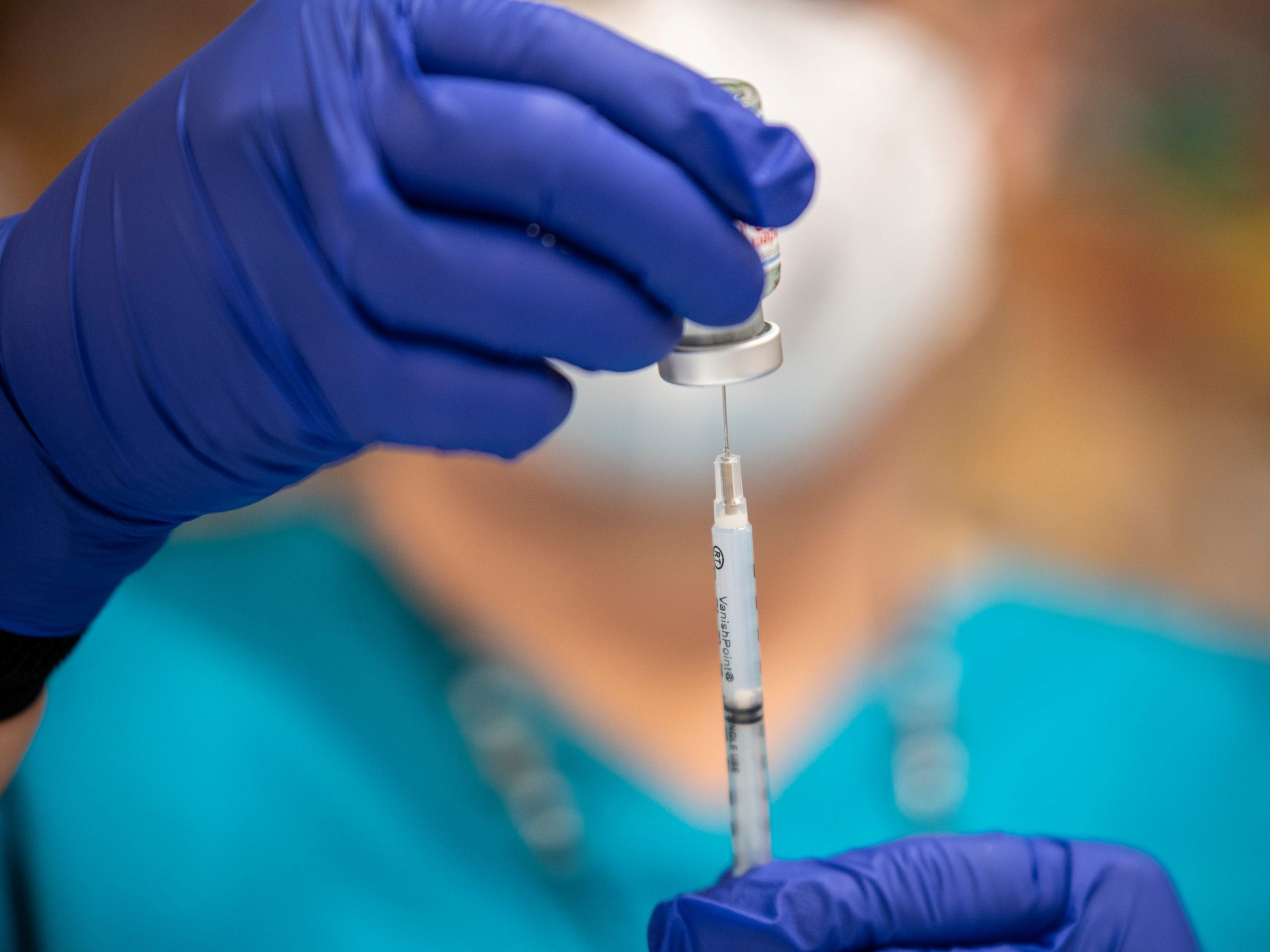 A nurse fills up a syringe with the Moderna COVID-19 vaccine at a vaccination site at a senior center on March 29, 2021 in San Antonio, Texas