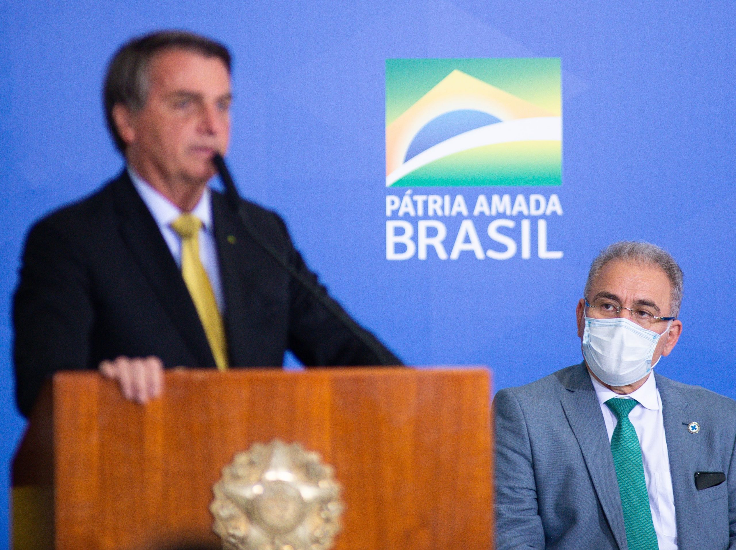 Brazilian health minister Marcelo Queiroga looks on the speech of President of Brazil Jair Bolsonaro during an event to launch a new register for professional workers of the fish industry at Planalto Government Palace on June 29, 2021 in Brasilia, Brazil.