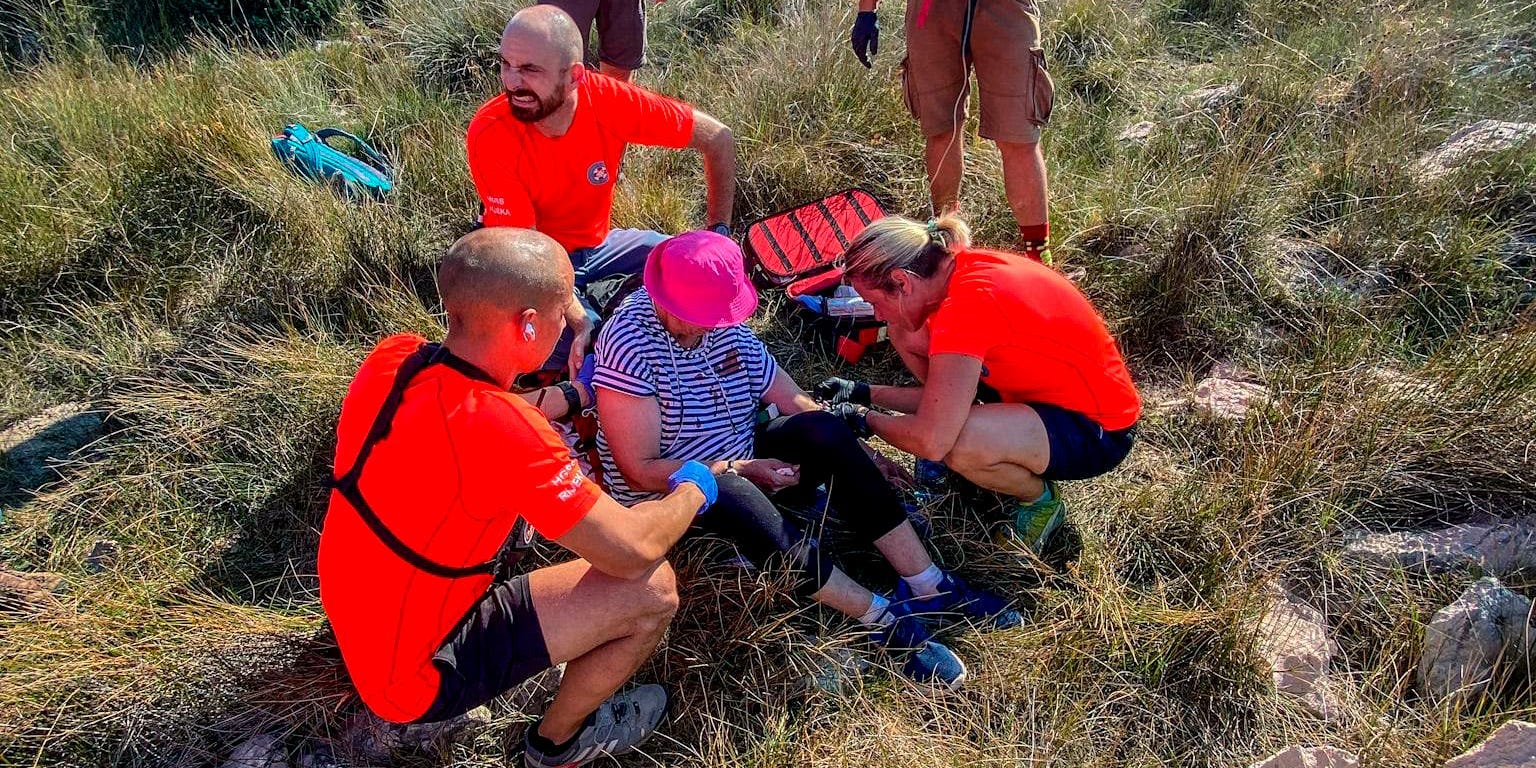 This photo provided by the Croatian Mountain Rescue Service, shows the rescue operation of an unidentified woman who was found on the Adriatic island of Krk on Sept. 12, 2021.