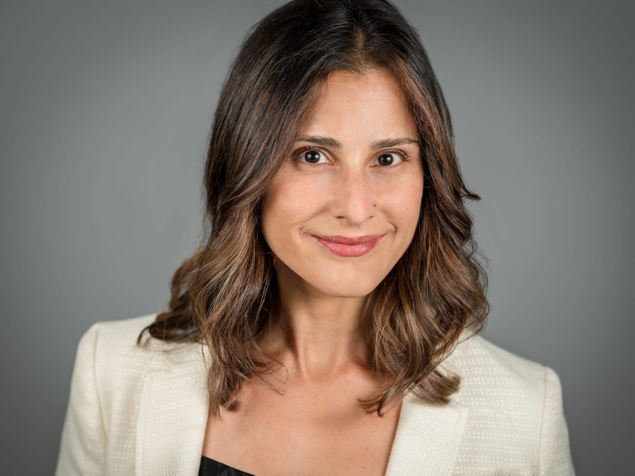 Headshot of Sheila Jamebekar, CPO of Plaid