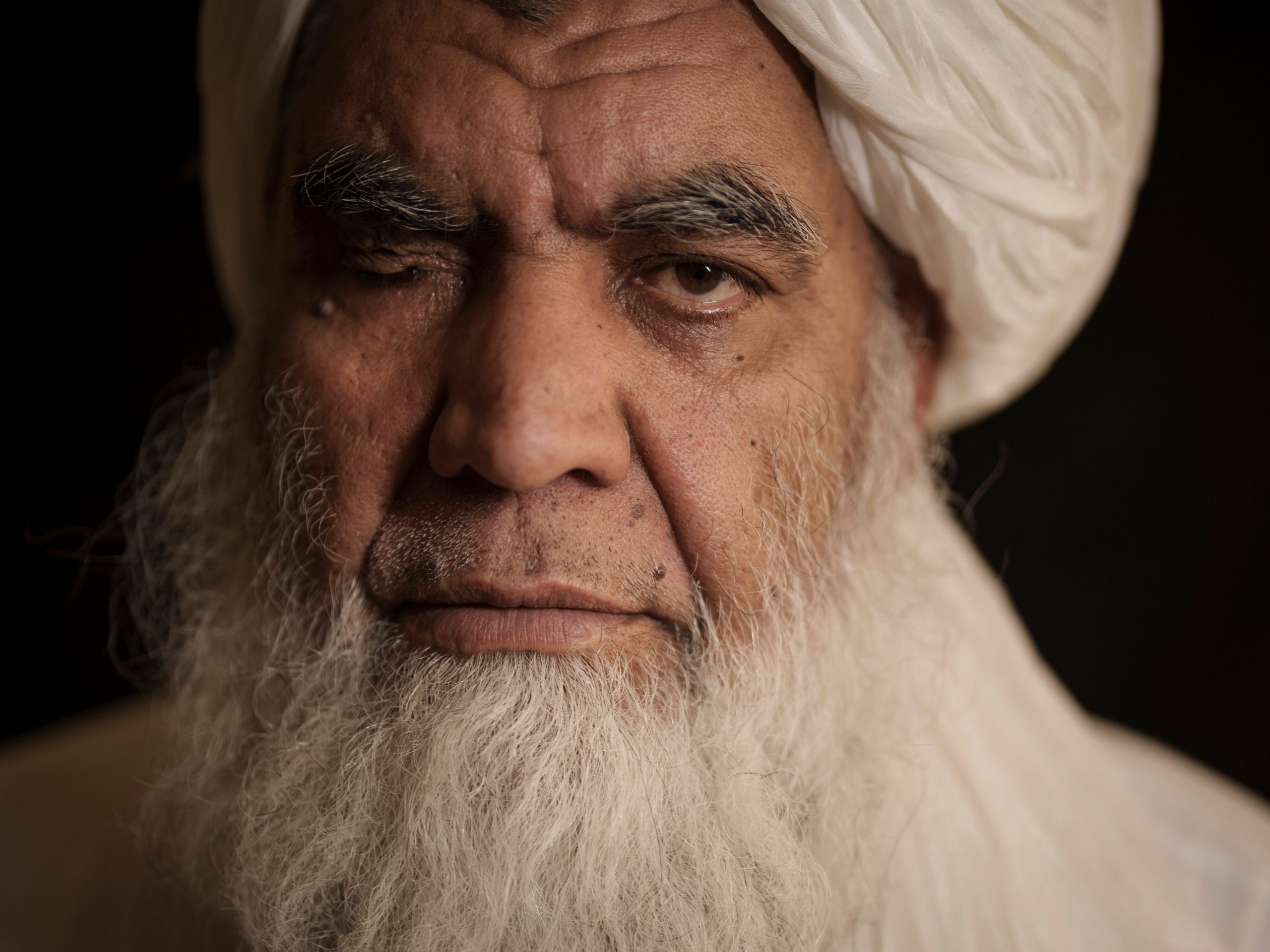 Taliban leader Mullah Nooruddin Turabi poses for a photo in Kabul, Afghanistan, Wednesday, Sept. 22, 2021. Mullah Turabi, one of the founders of the Taliban, says the hard-line movement will once again carry out punishments like executions and amputations of hands, though perhaps not in public.