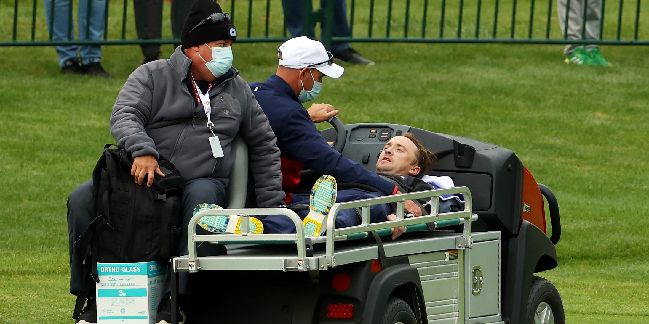 Tom Felton is carted off the course after collapsing during the celebrity matches ahead of the 43rd Ryder Cup at Whistling Straits on September 23, 2021 in Kohler, Wisconsin.