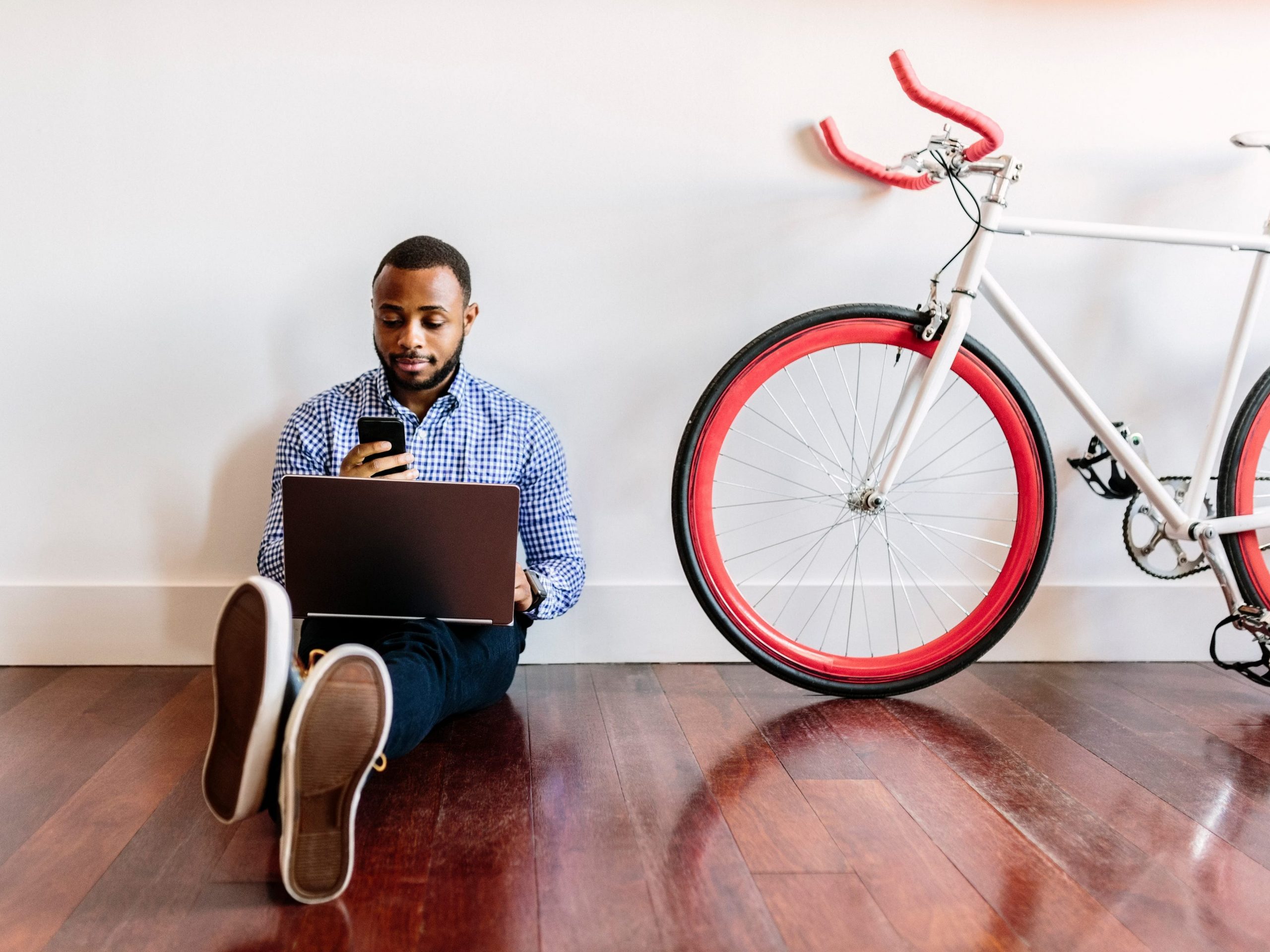 Man working from home with a bicycle.