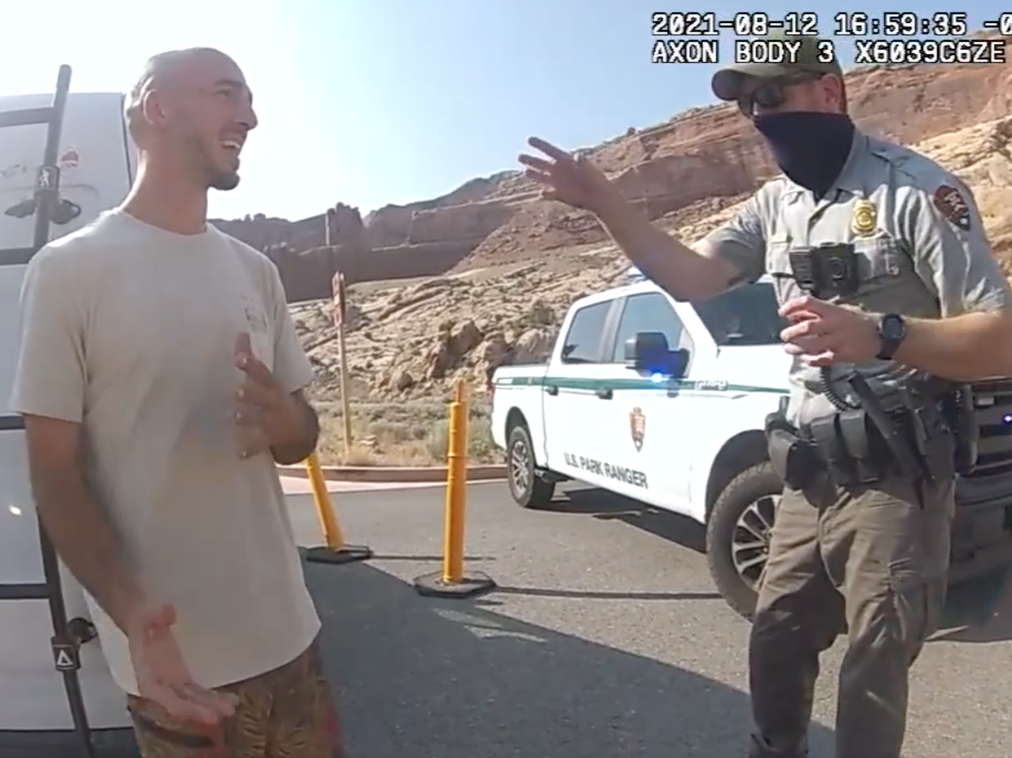 A screenshot from Utah police bodycam footage showing Brian Laundrie talking to a police officer.