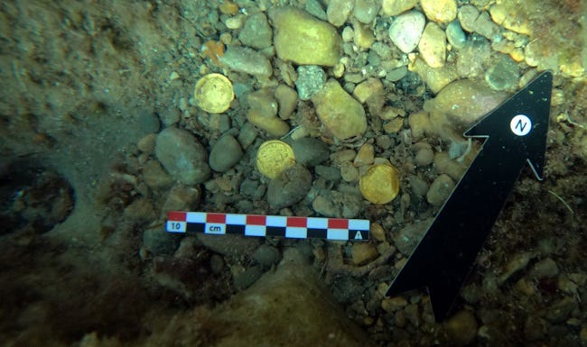 Amateur freedivers found a large collection of gold Roman coins off the coast of Spain.