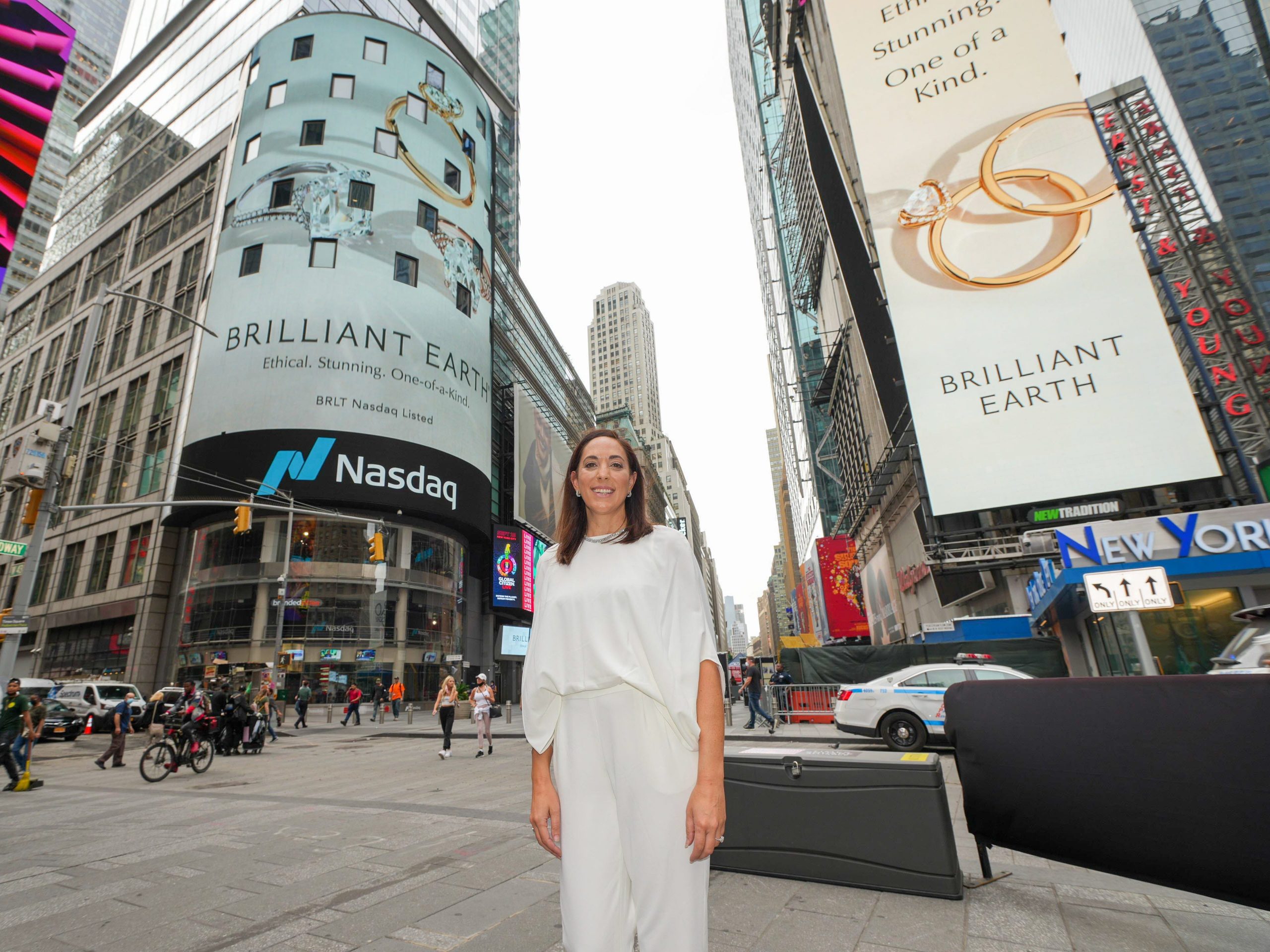 Brilliant Earth cofounder and CEO poses in Times Square in front of the NASDAQ billboard on the day of the company's IPO.