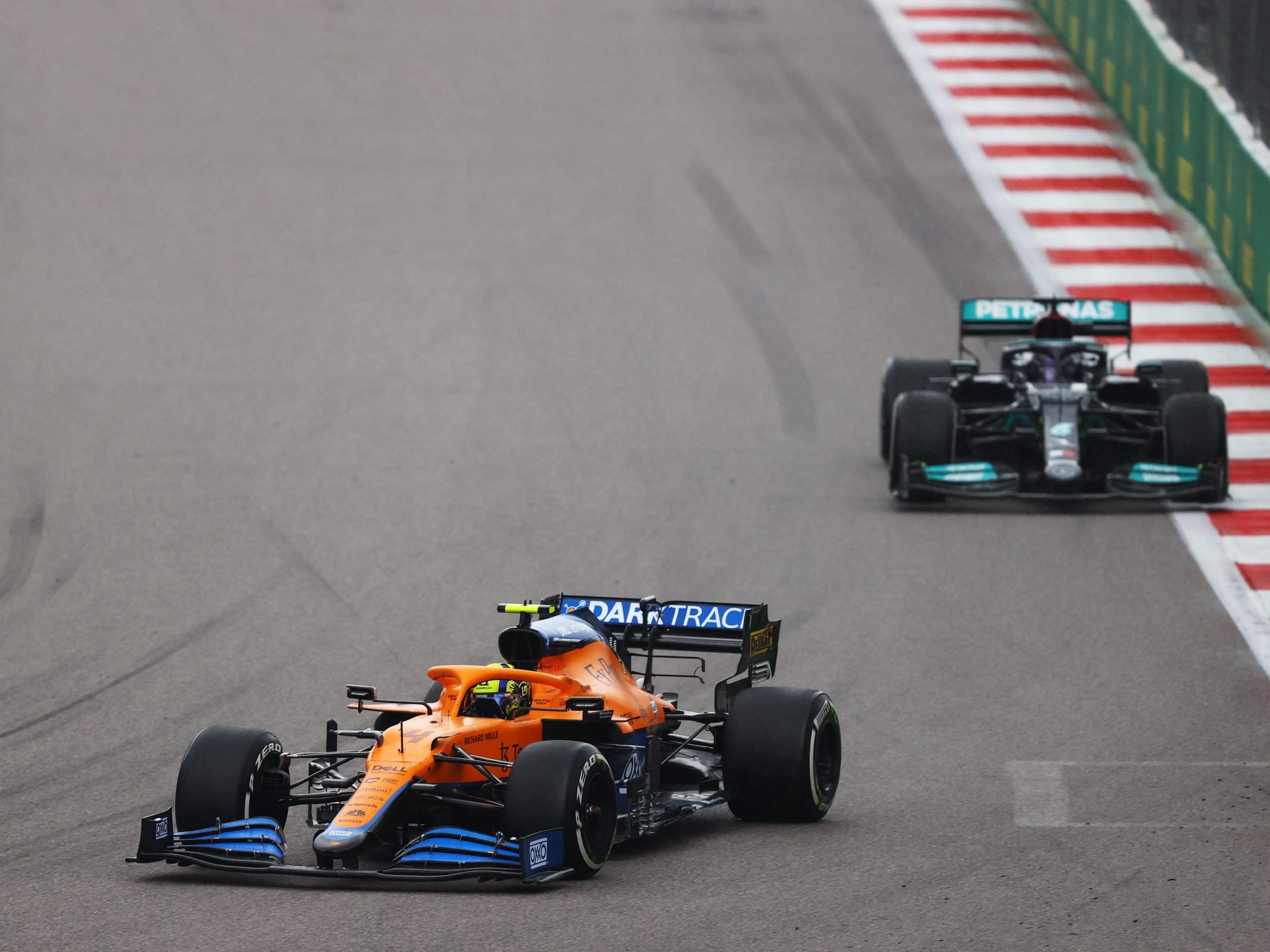 Lando Norris drives ahead of Lewis Hamilton at the Russian Grand Prix