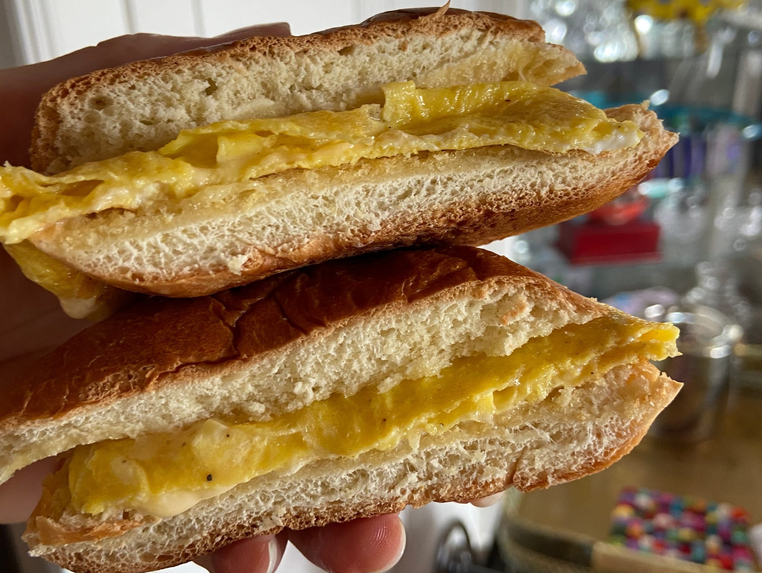 An egg sandwich made with hamburger buns.