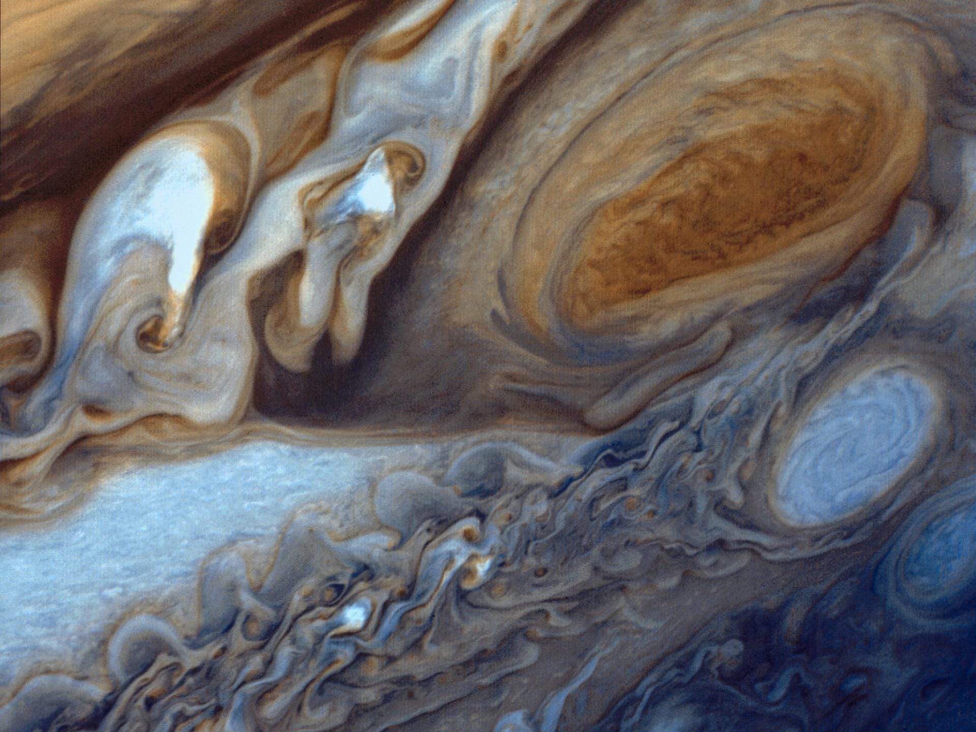 jupiter great red spot oval shaped up close in colorful swirling clouds