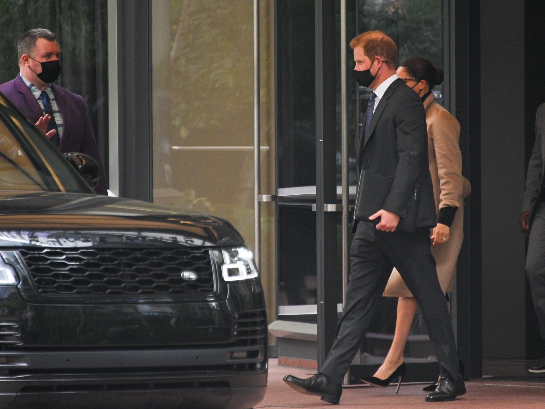 Prince Harry and Meghan Markle walk out of the United Nations.