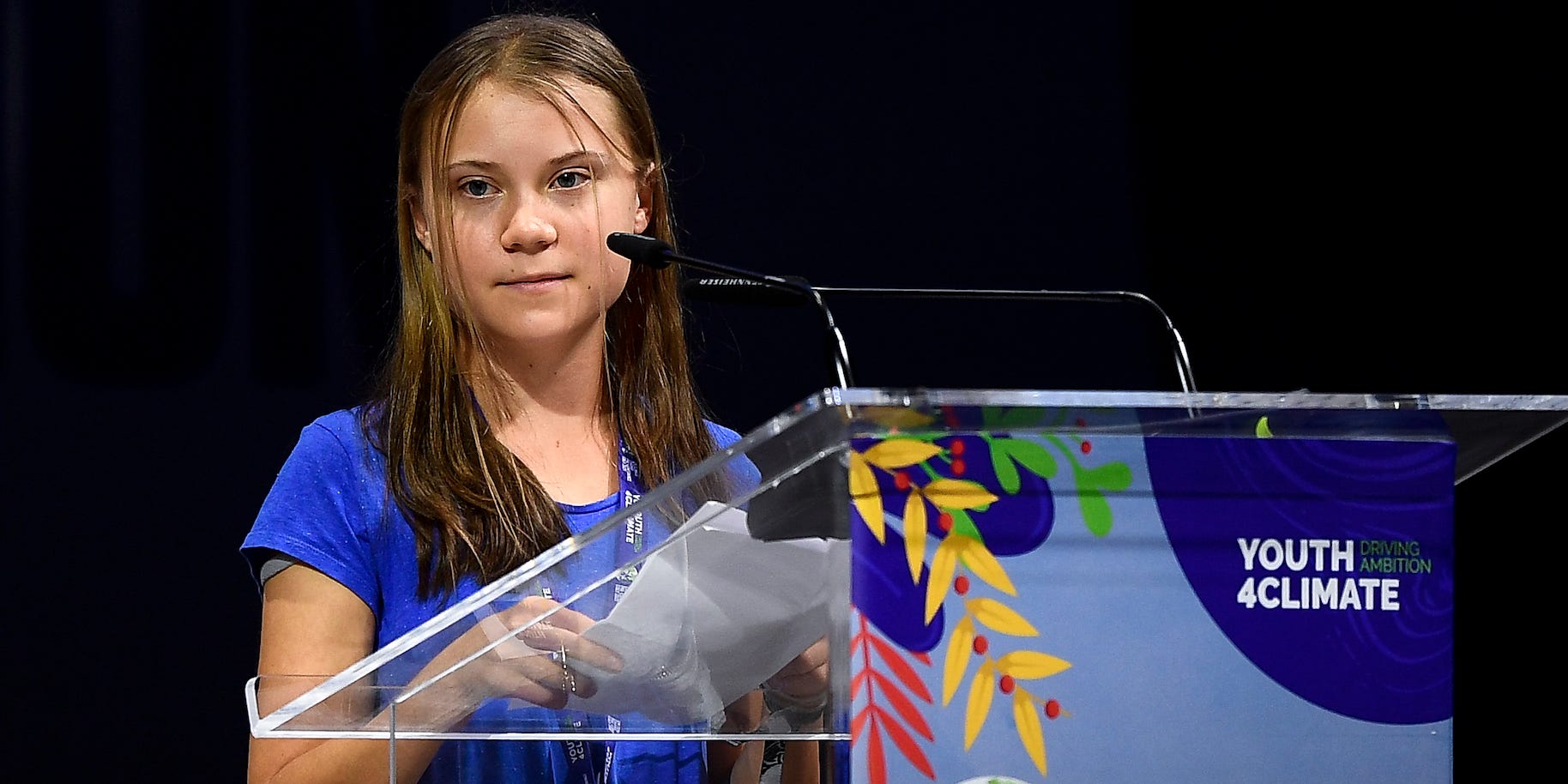 Greta Thunberg speaks at a podium