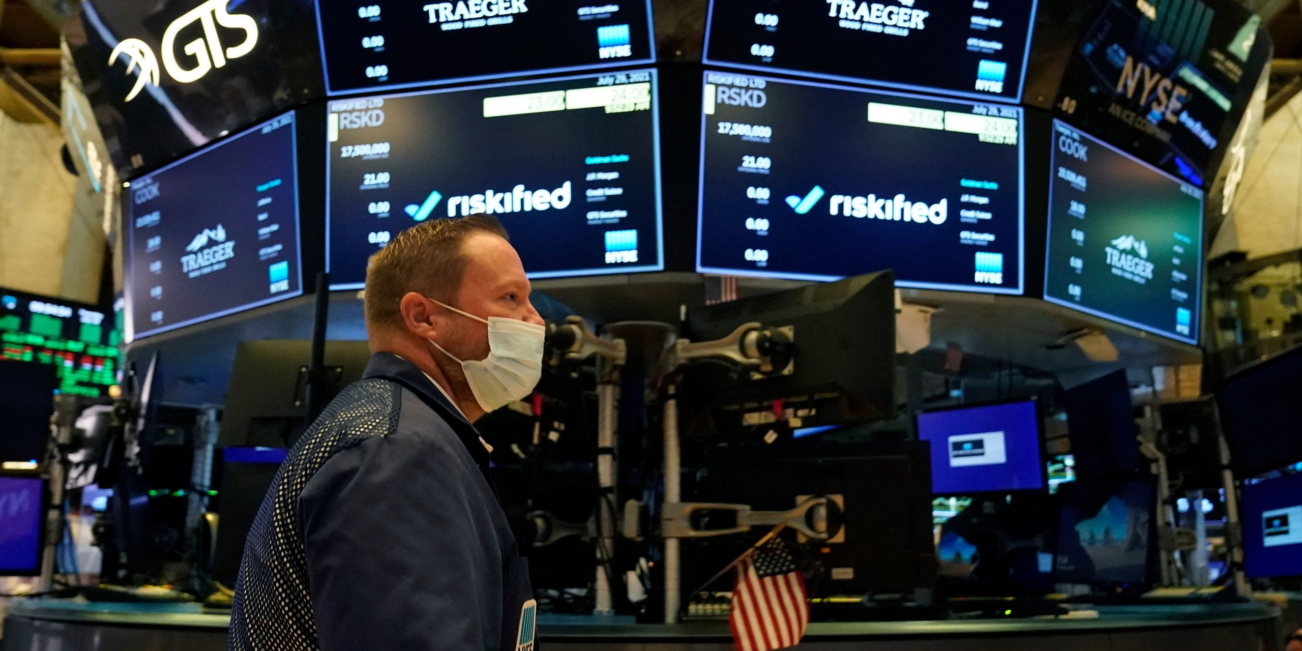 Traders work on the floor at the New York Stock Exchange in New York, on July 29, 2021.
