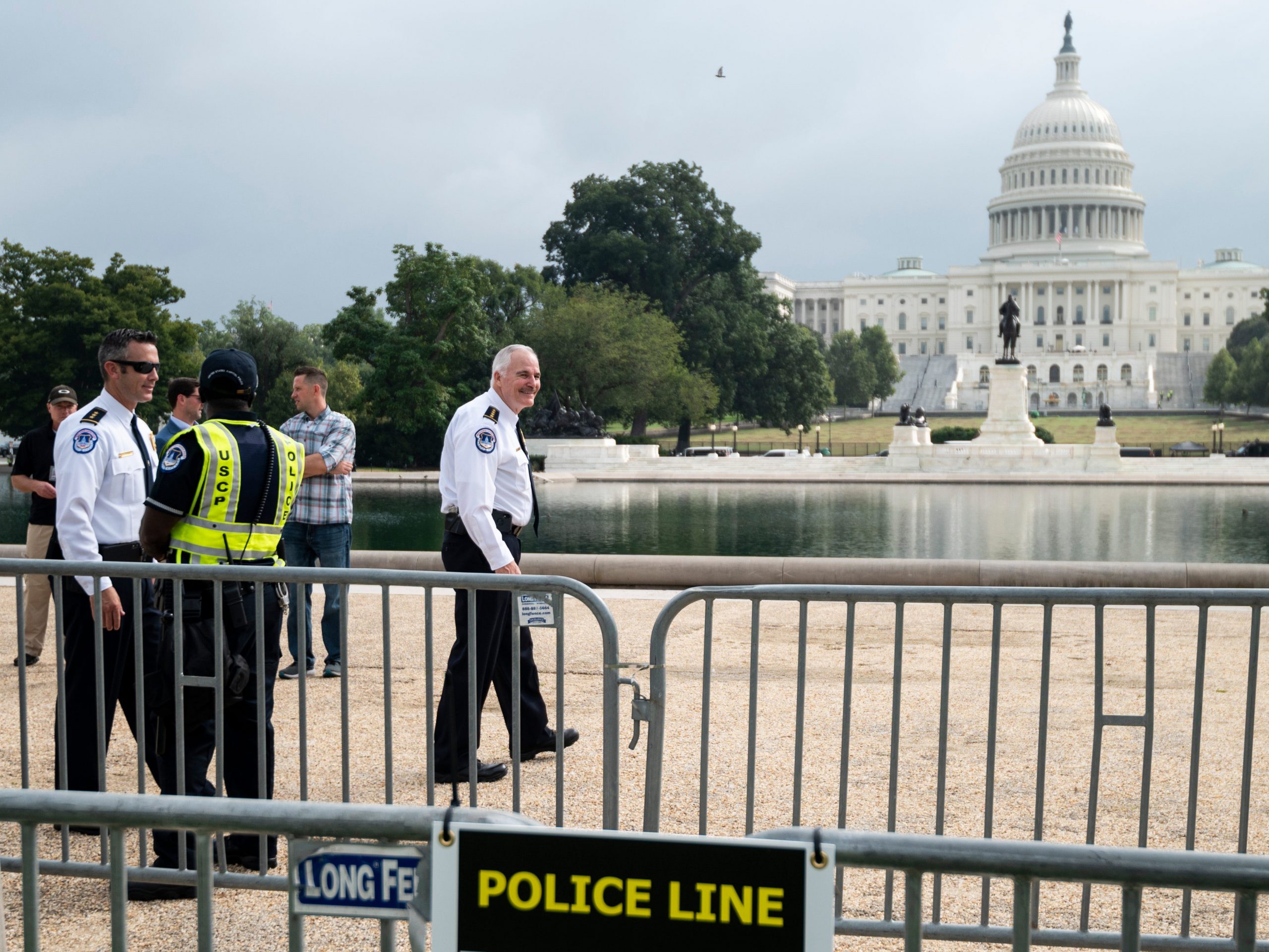 US Capitol Police Chief Tom Manger walks along the bike rack fence by the Capitol Reflecting Pool before the start of the “Justice for J6” rally on September 18th, 2021.