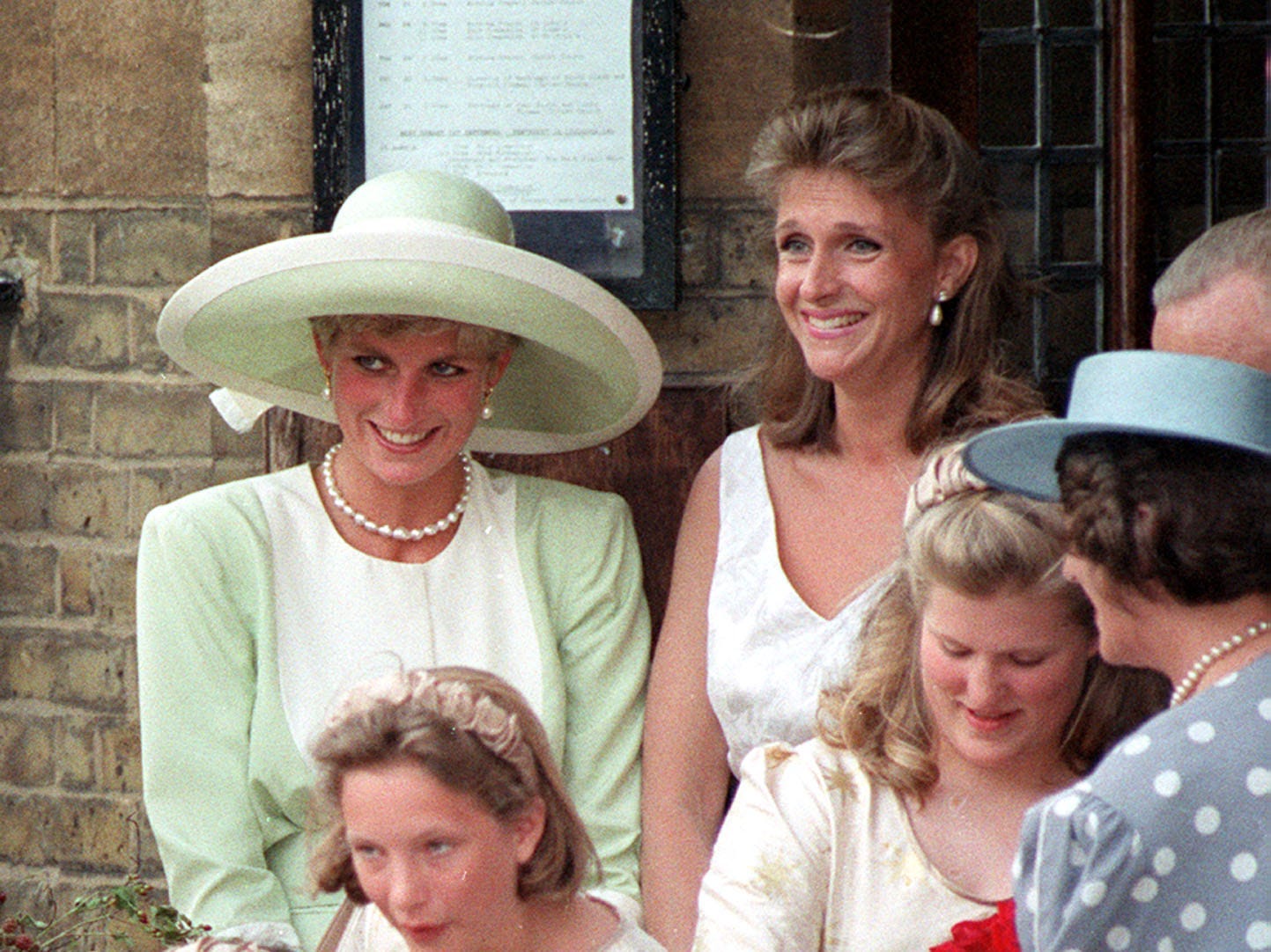 Princess Diana stands next to Virginia Clarke, formerly Pitman, at her wedding in London in 1991.