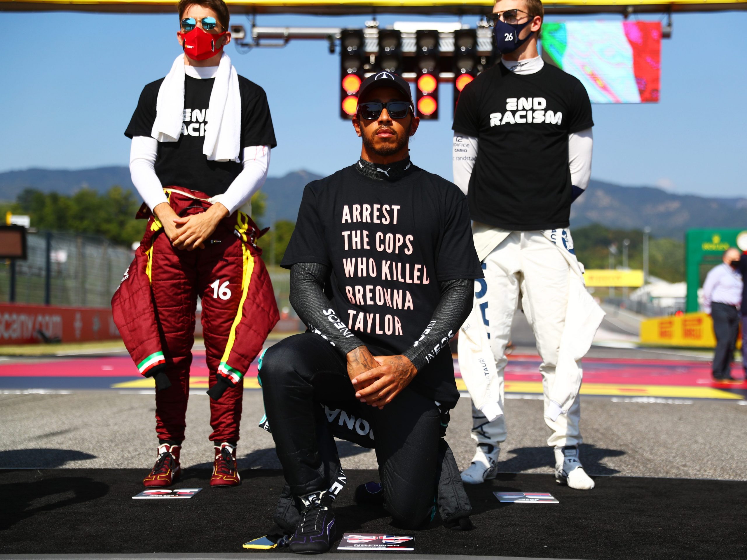 Lewis Hamilton of Great Britain and Mercedes GP wears a t-shirt displaying the message 'arrest the cops who killed Breonna Taylor'