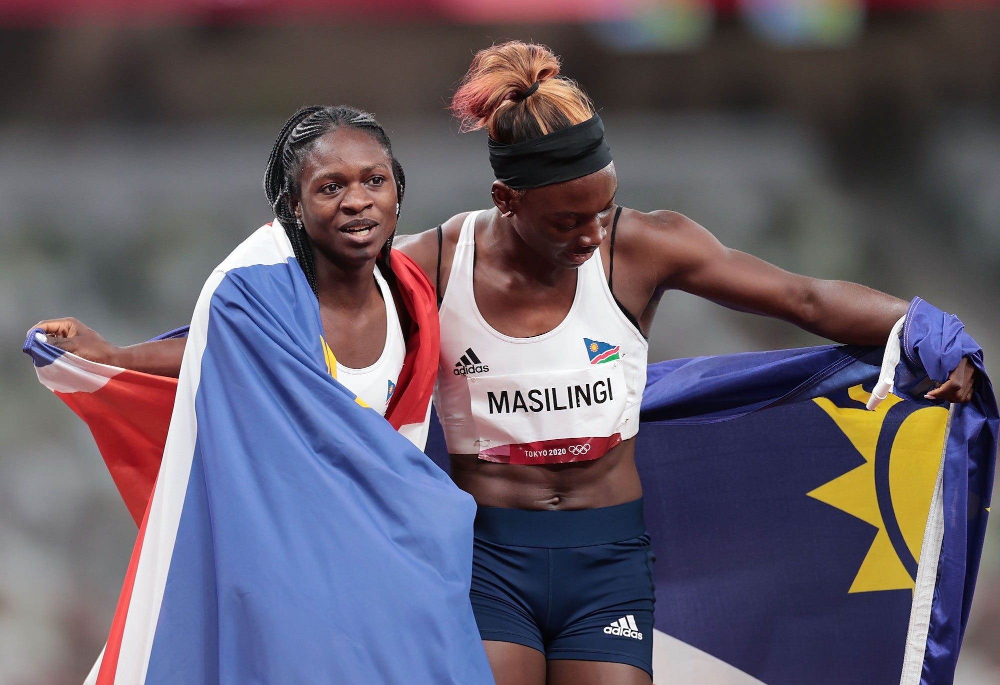 Christine Mboma celebrates with Beatrice Masilingi of Namibia after the women's 200m final at Tokyo 2020 Olympic Games