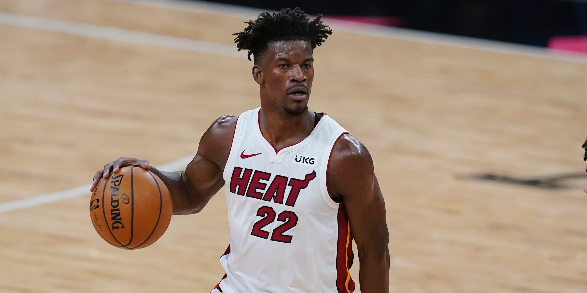 Jimmy Butler dribbles the ball during a game in 2021.