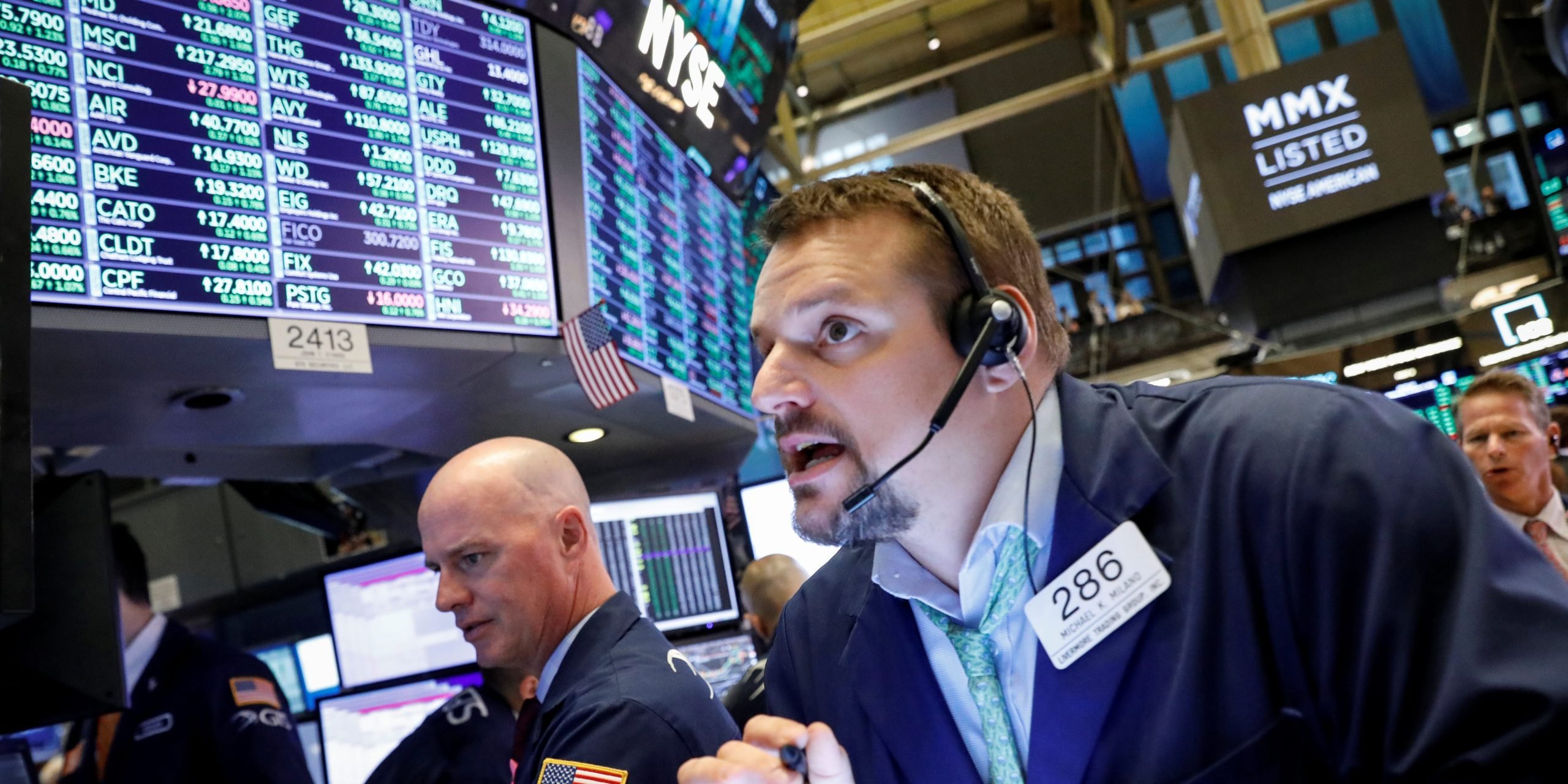 Traders work on the floor at the New York Stock Exchange (NYSE) in New York, U.S., October 9, 2019. REUTERS/Brendan McDermid