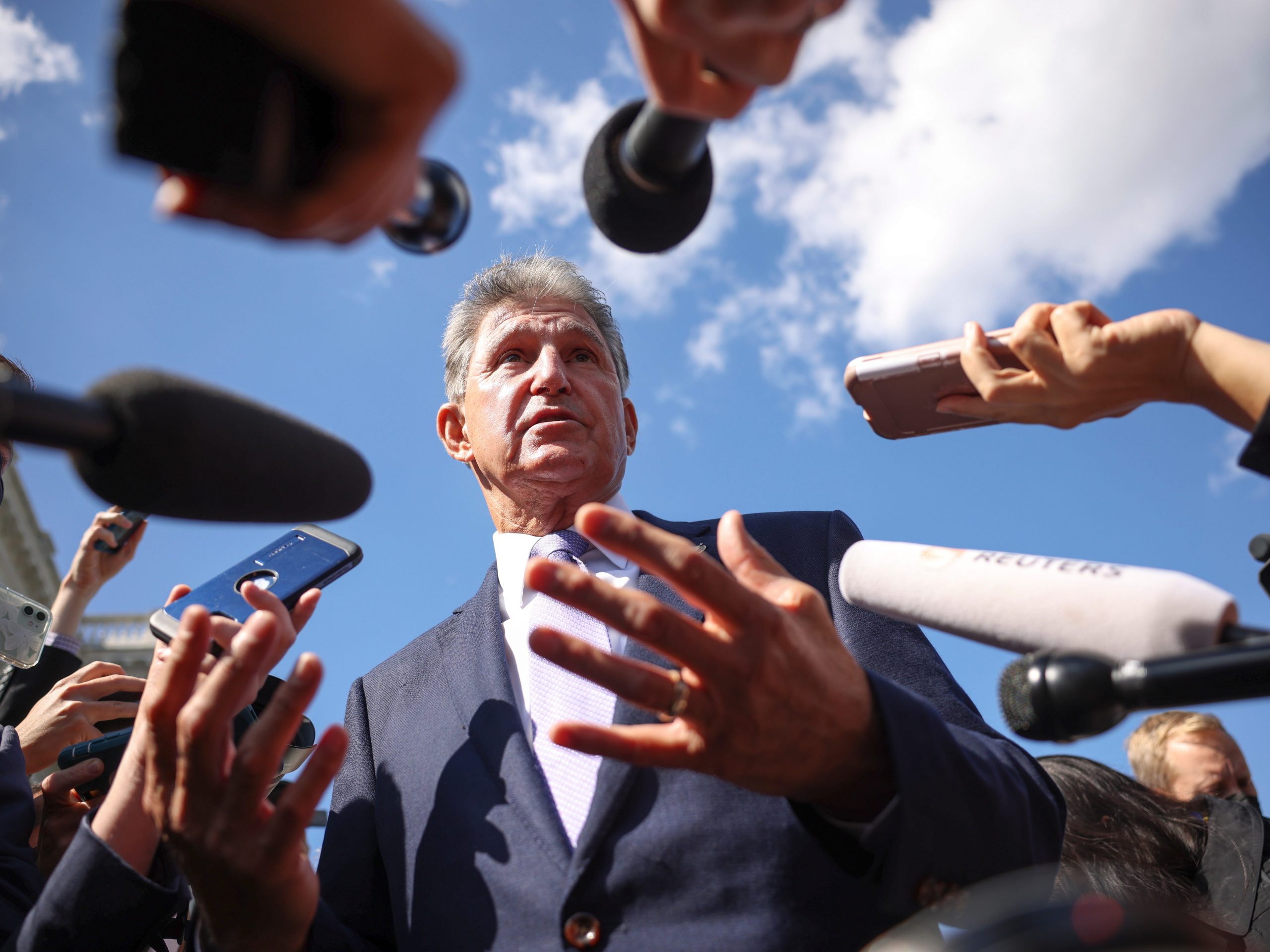 Democratic Sen. Joe Manchin of West Virginia speaks to reporters outside of the U.S. Capitol on September 30, 2021.