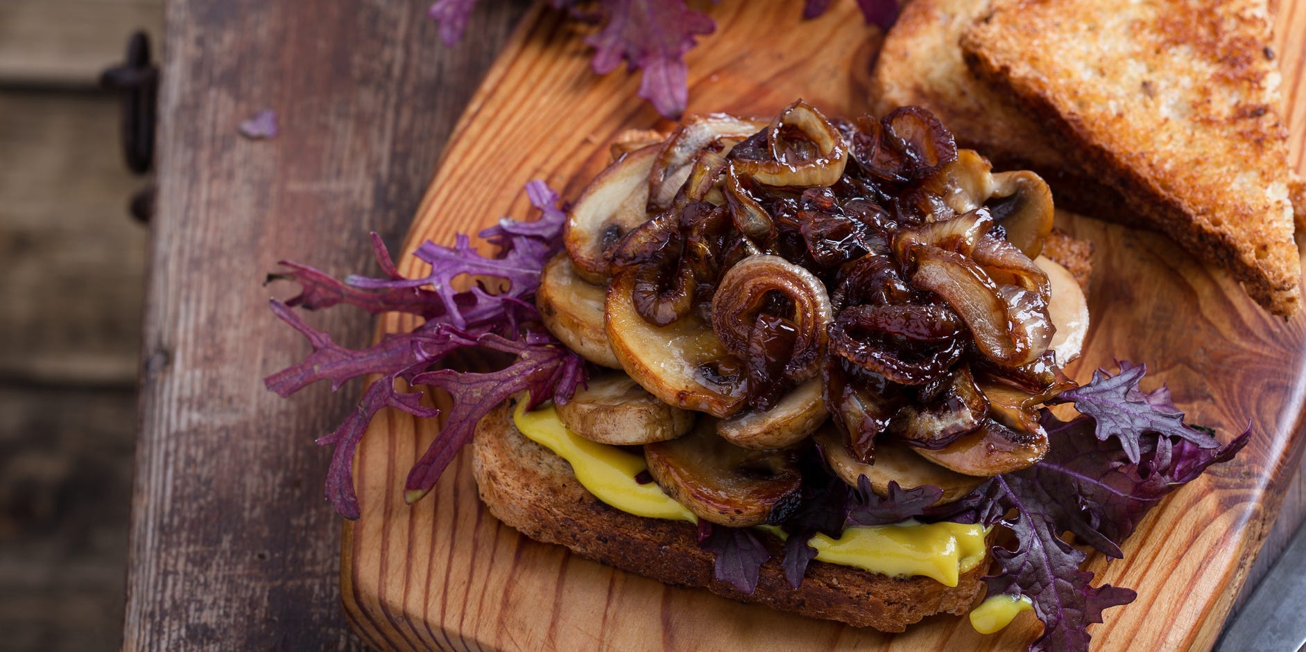 Caramelized onions on top of a sandwich.