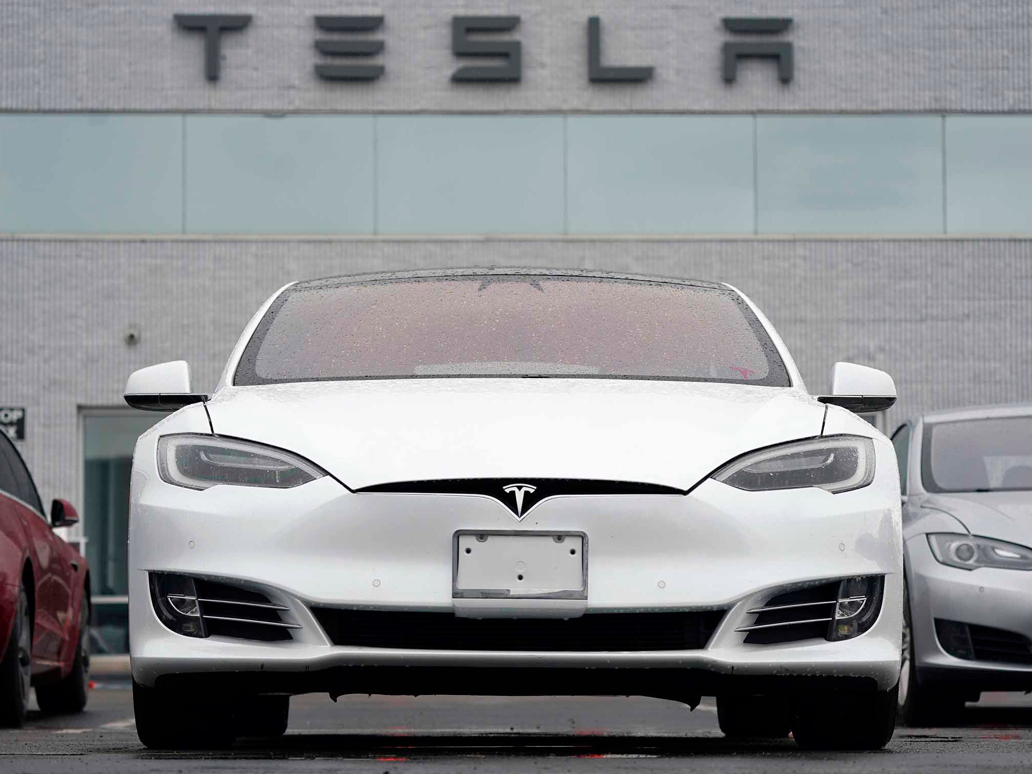 A white Tesla Model S is pictured at a Tesla facility in Littleton, Colorado.