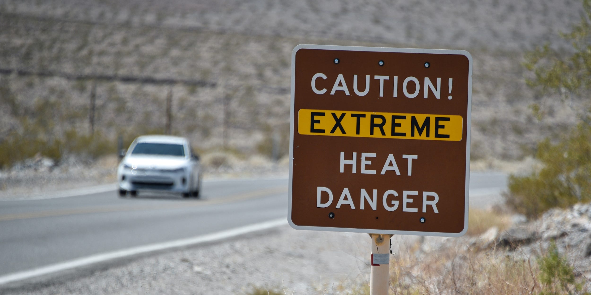 A posted sign warns motorists of extreme heat dangers in Death Valley National Park, in Furnace Creek, California, U.S. August 17, 2020.