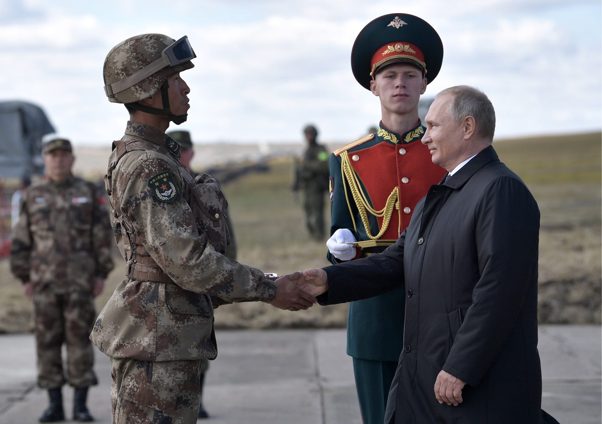 Russian President Vladimir Putin with Chinese soldier