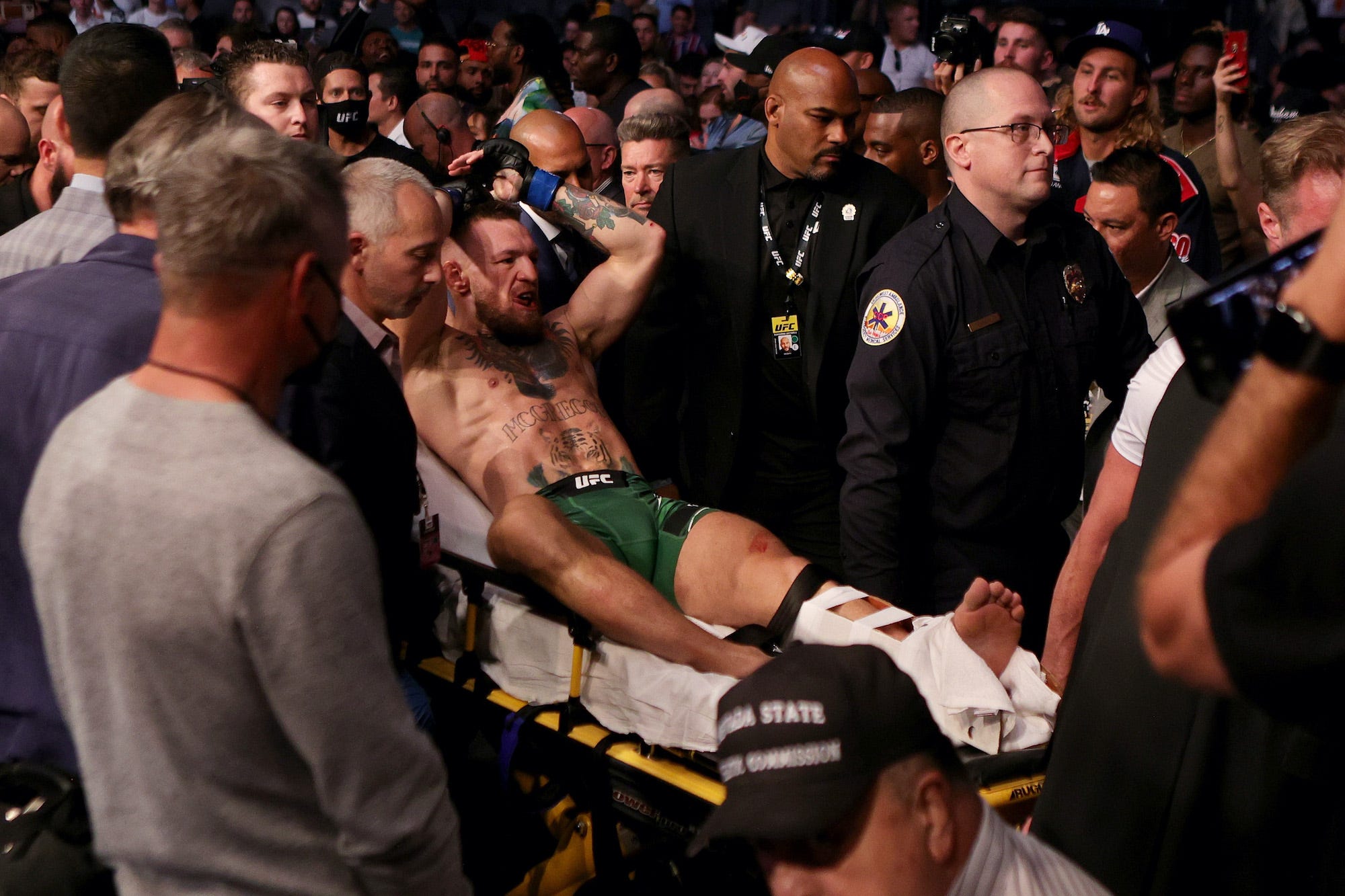 Conor McGregor is stretchered out of the arena.