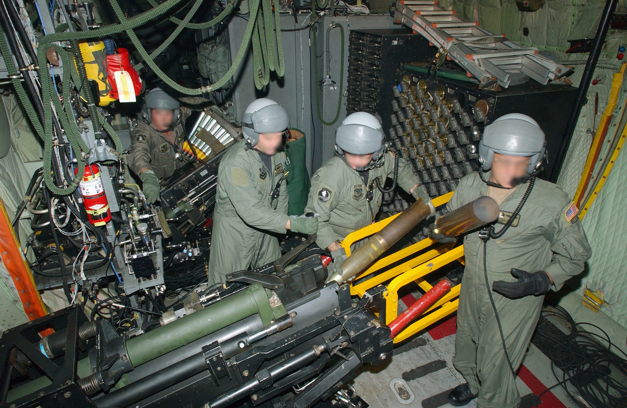 Aircrew load cannon aboard AC-130