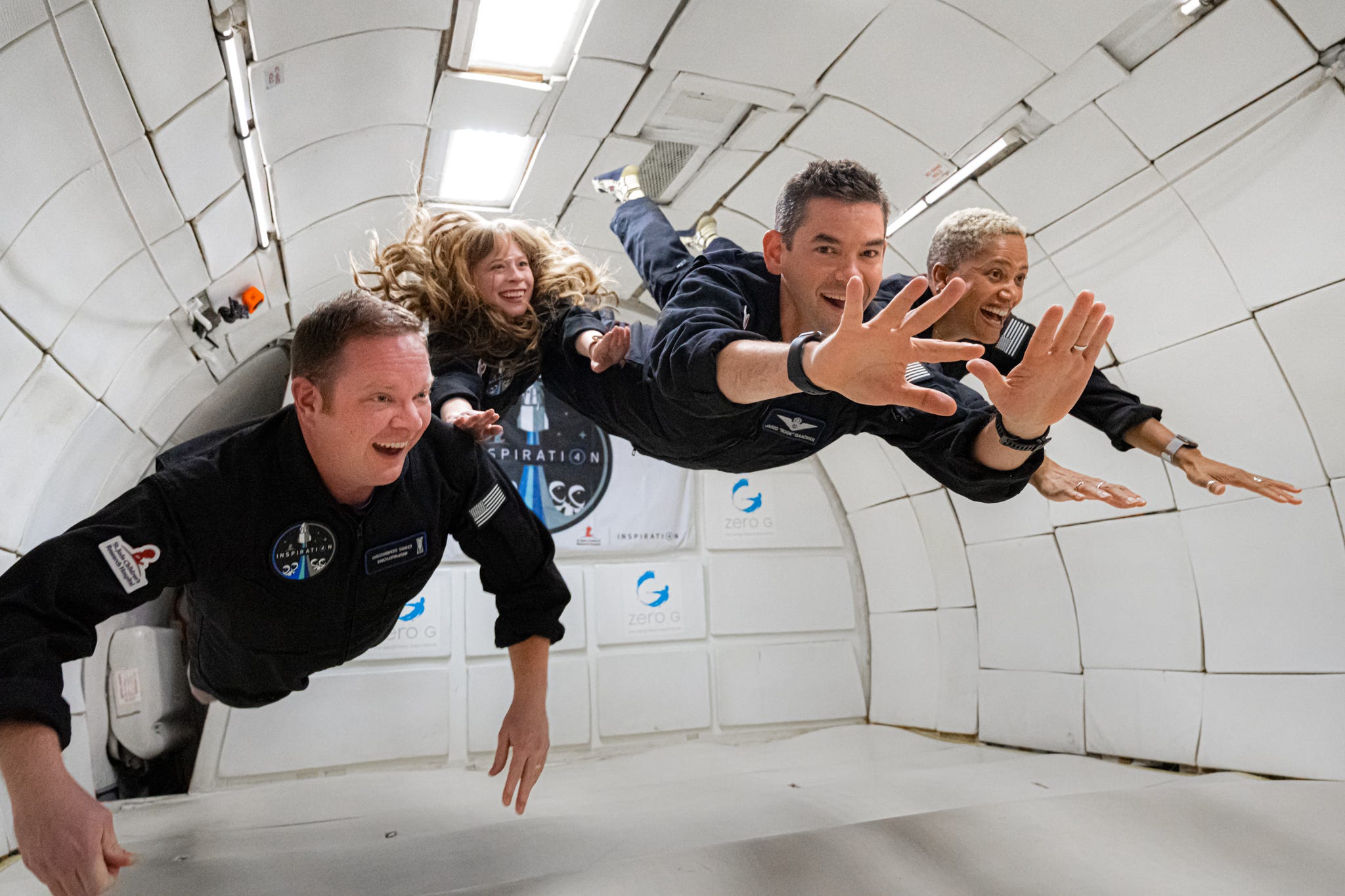 inspiration4 crew members screaming joy floating weightless inside plane