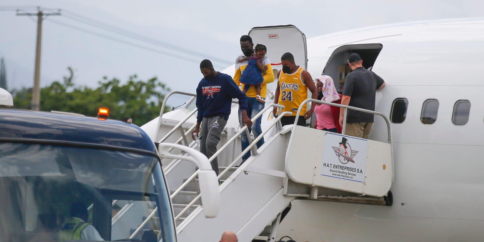 Haitians who were deported from the United States deplane at the Toussaint Louverture International Airport, in Port au Prince, Haiti, Sunday, Sep. 19, 2021.