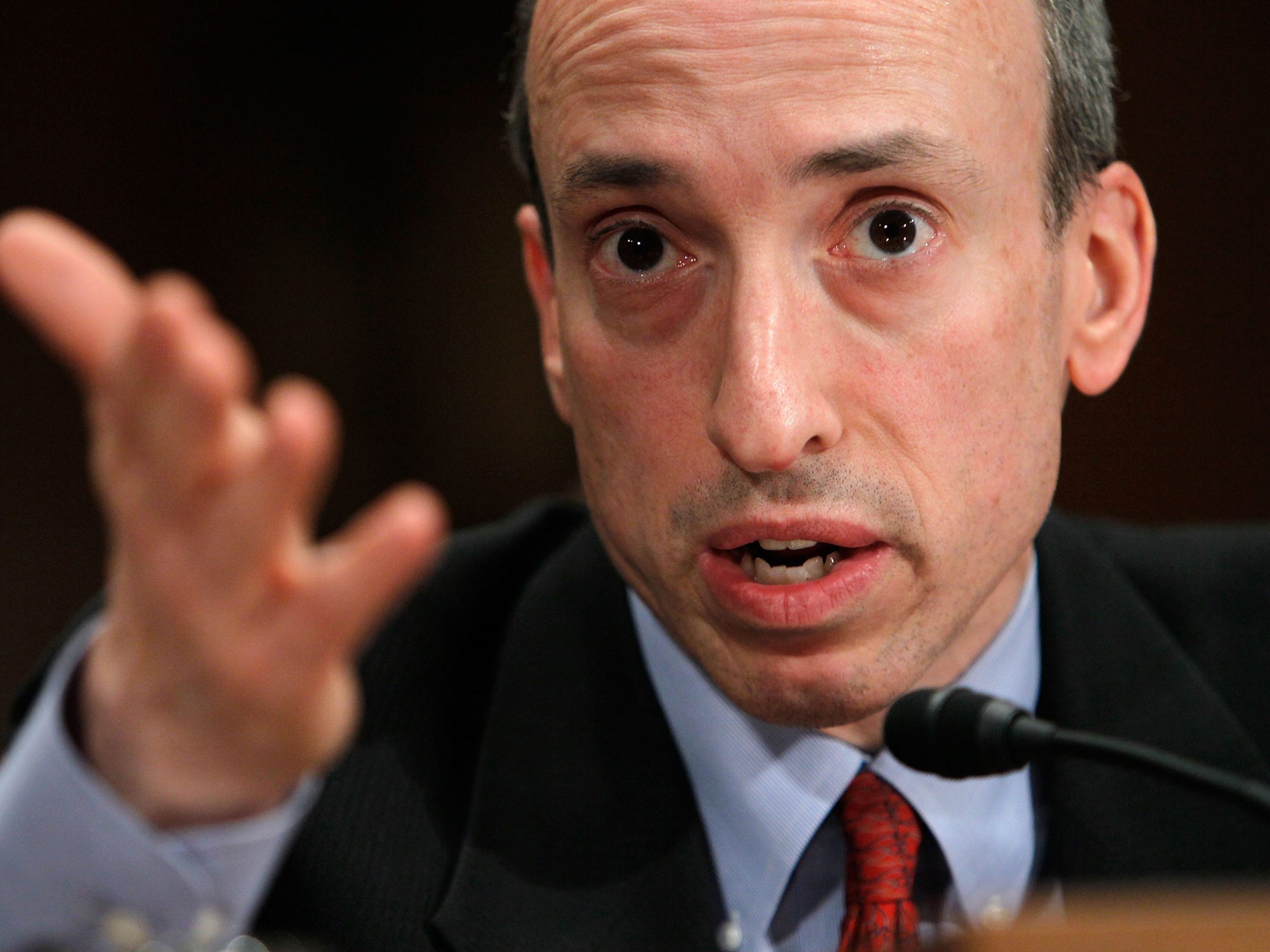 US Securities and Exchange Commission chairman Gary Gensler speaks into a microphone and gestures with his hand