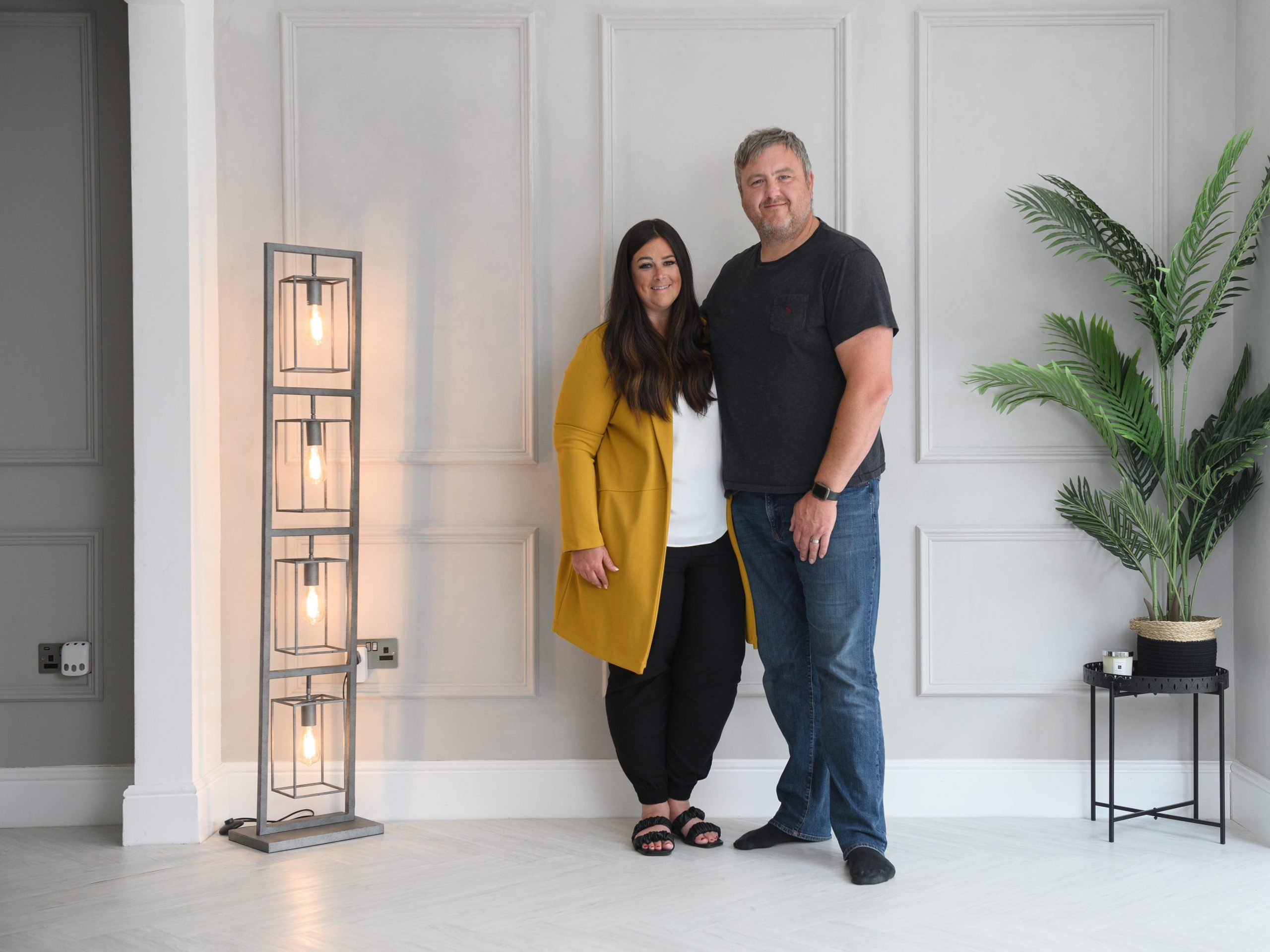 Natalie and Andrew Cunliffe pose for a photograph in their newly renovated home.