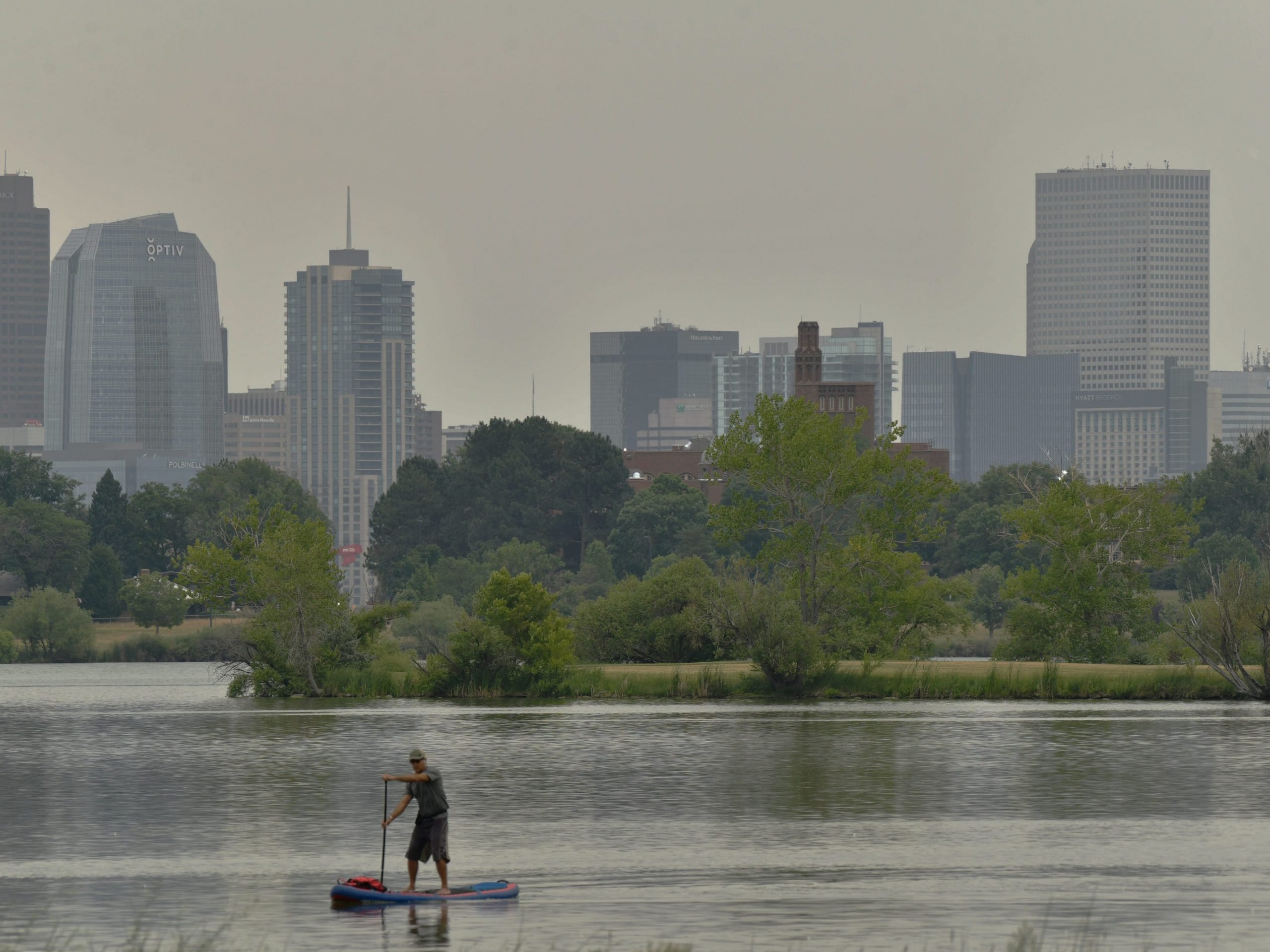 A hazy view of the downtown Denver skyline from Sloan Lake in Denver, Colorado on Tuesday, August 3, 2021.