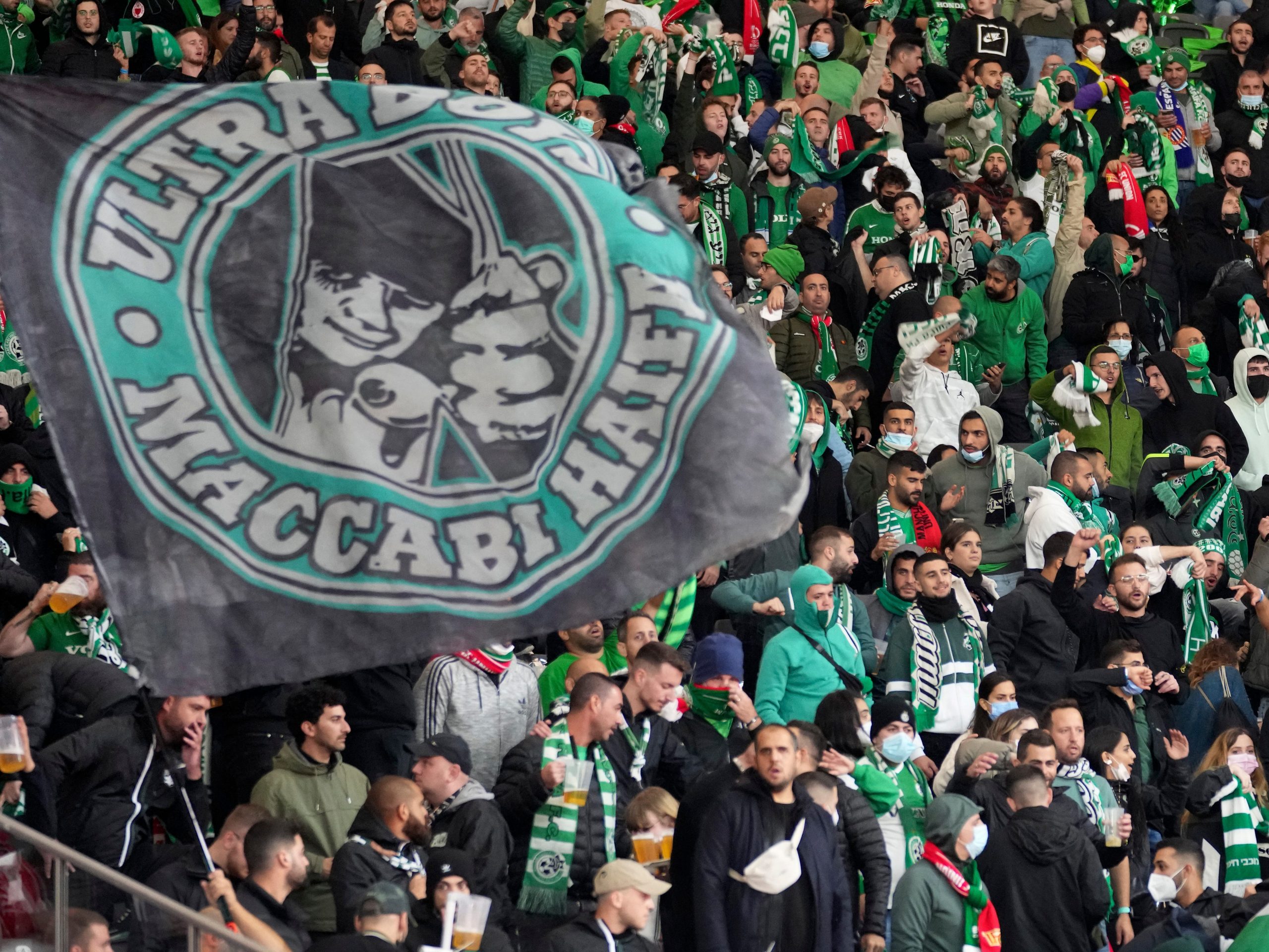 Supporters of Haifa attend a group E Europa Conference League soccer match between 1. FC Union Berlin and Maccabi Haifa FC in Berlin, Germany, Thursday, Sept. 30, 2021.