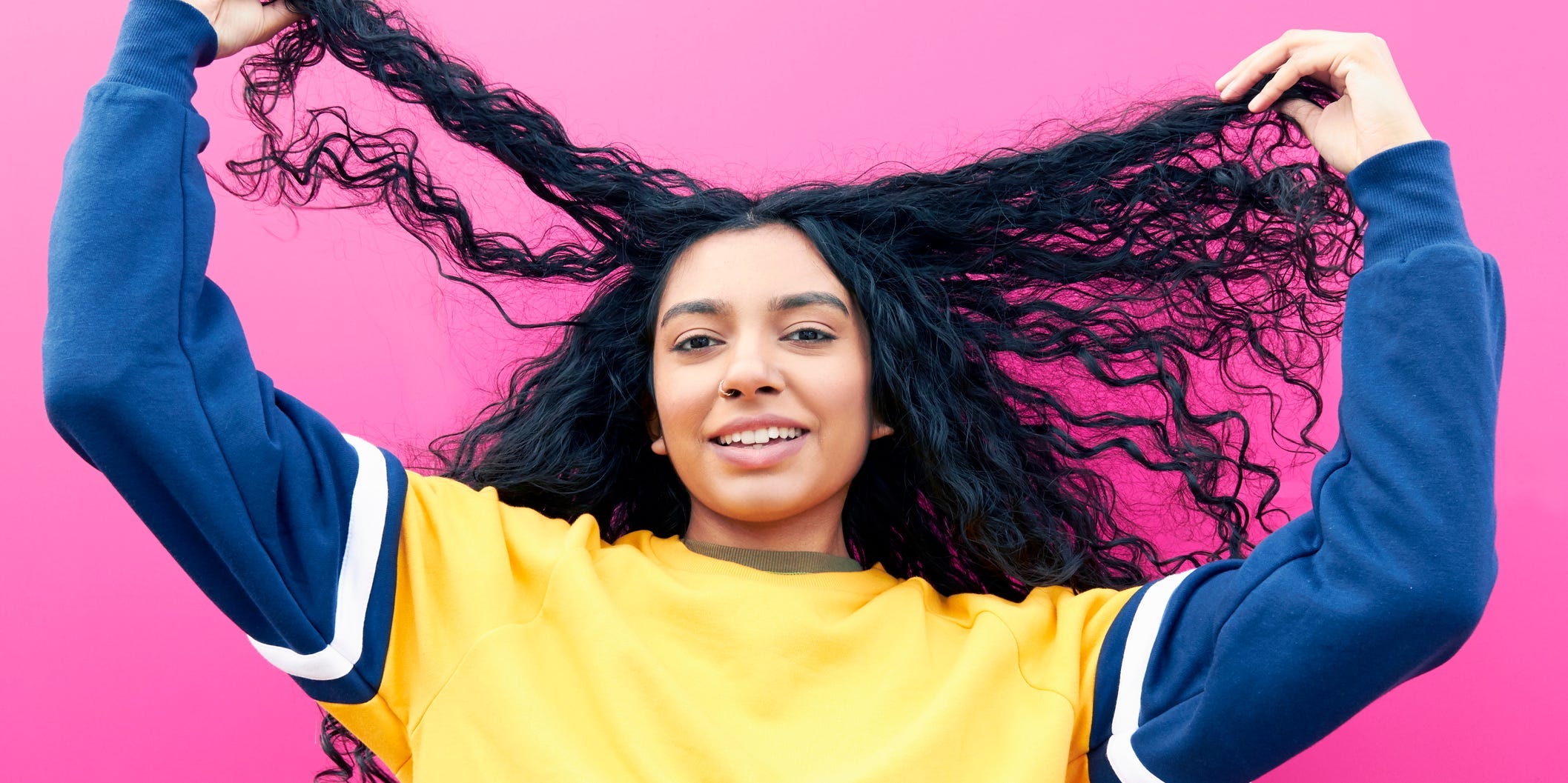 Curly wavy long hair woman of color