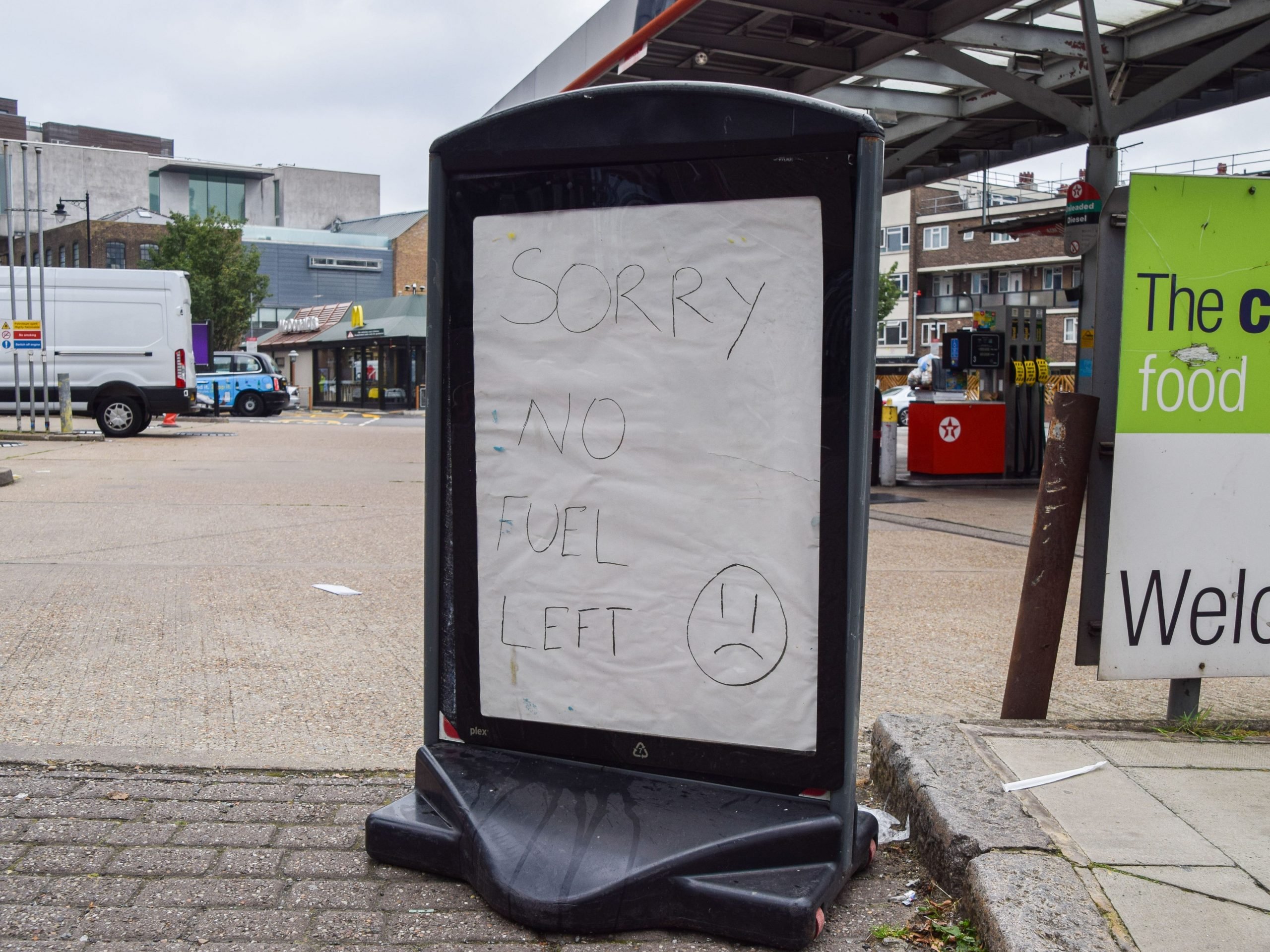 Sign at petrol station saying "sorry no fuel left".