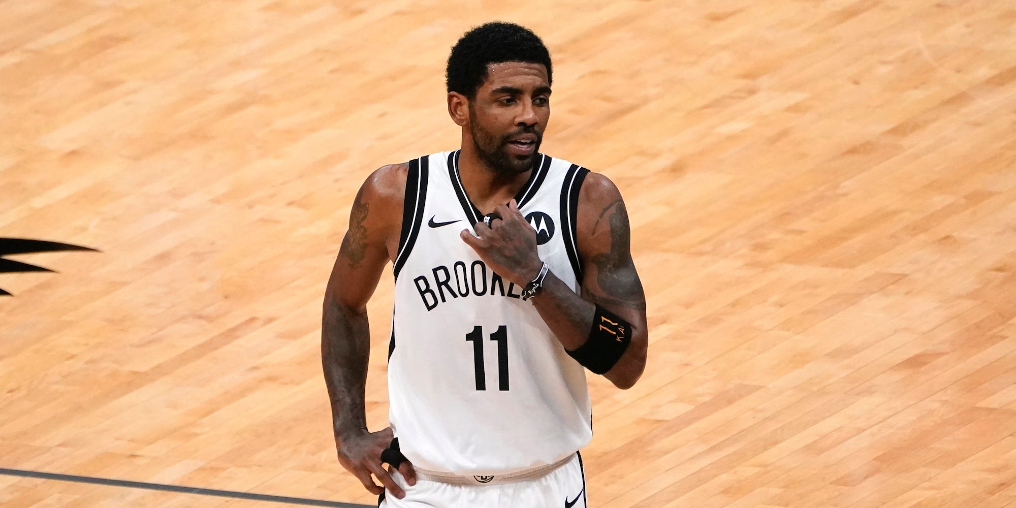 Kyrie Irving looks on during a game in 2021.