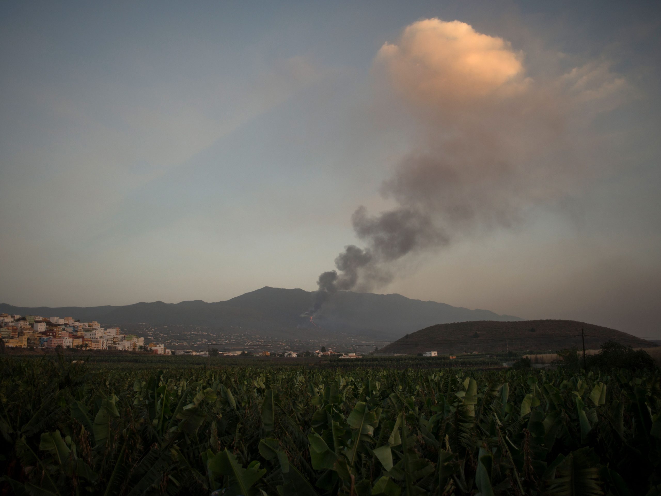 The Cumbre Vieja volcano, pictured from Tazacorte, spews lava, ash and smoke, in the Canary Island of La Palma on October 2, 2021.