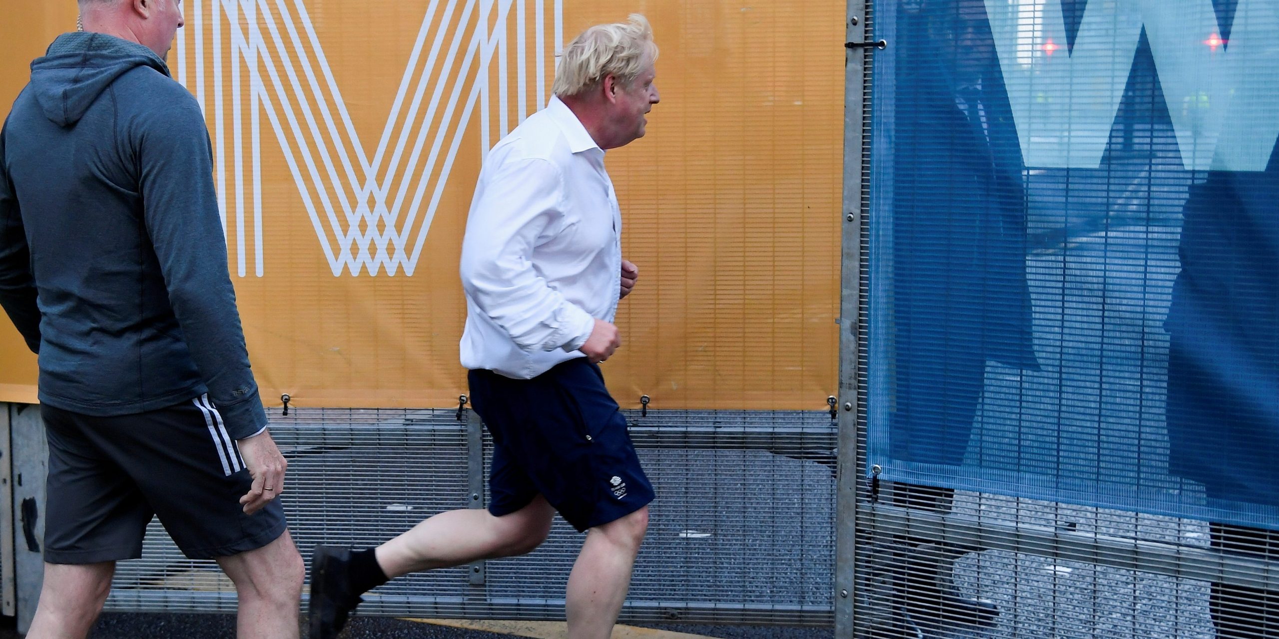 Britain's Prime Minister Boris Johnson jogs in the morning before the annual Conservative Party conference in Manchester, Britain, October 3, 2021