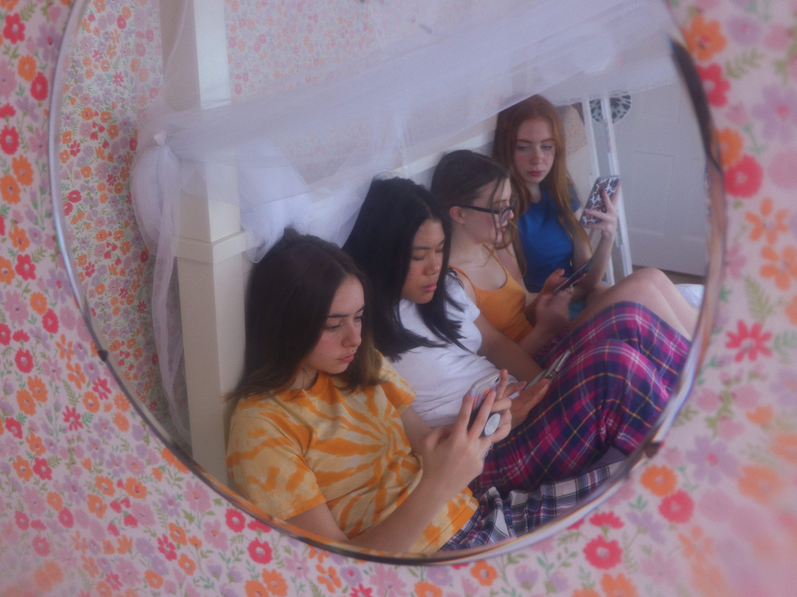 Group of teenage girls using their cell phones