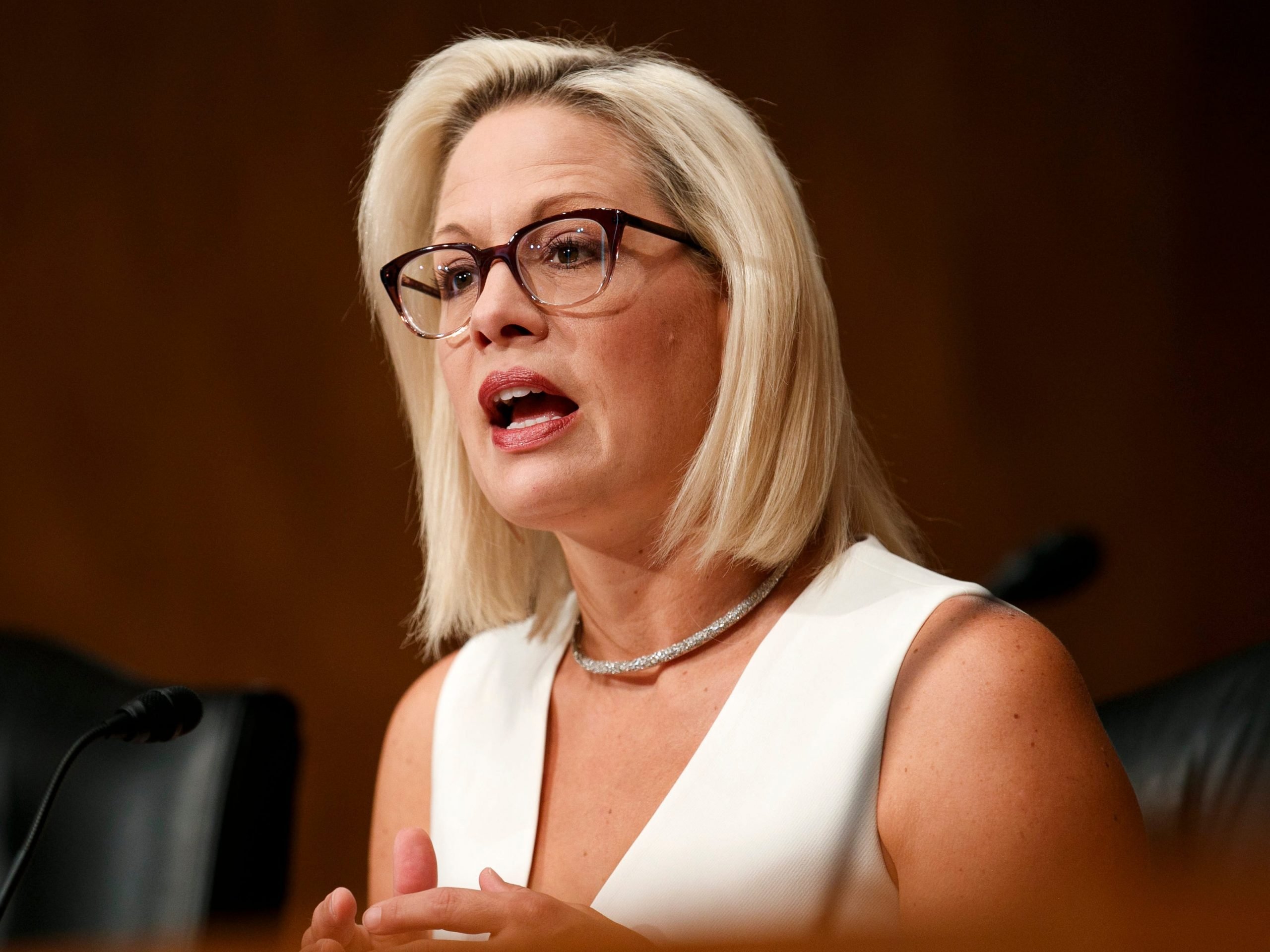 Sen. Krysten Sinema, D-Ariz., ask questions of the panel during a Senate Homeland Security and Governmental Affairs committee on conditions at the Southern border, Tuesday, July 30, 2019, on Capitol Hill in Washington.