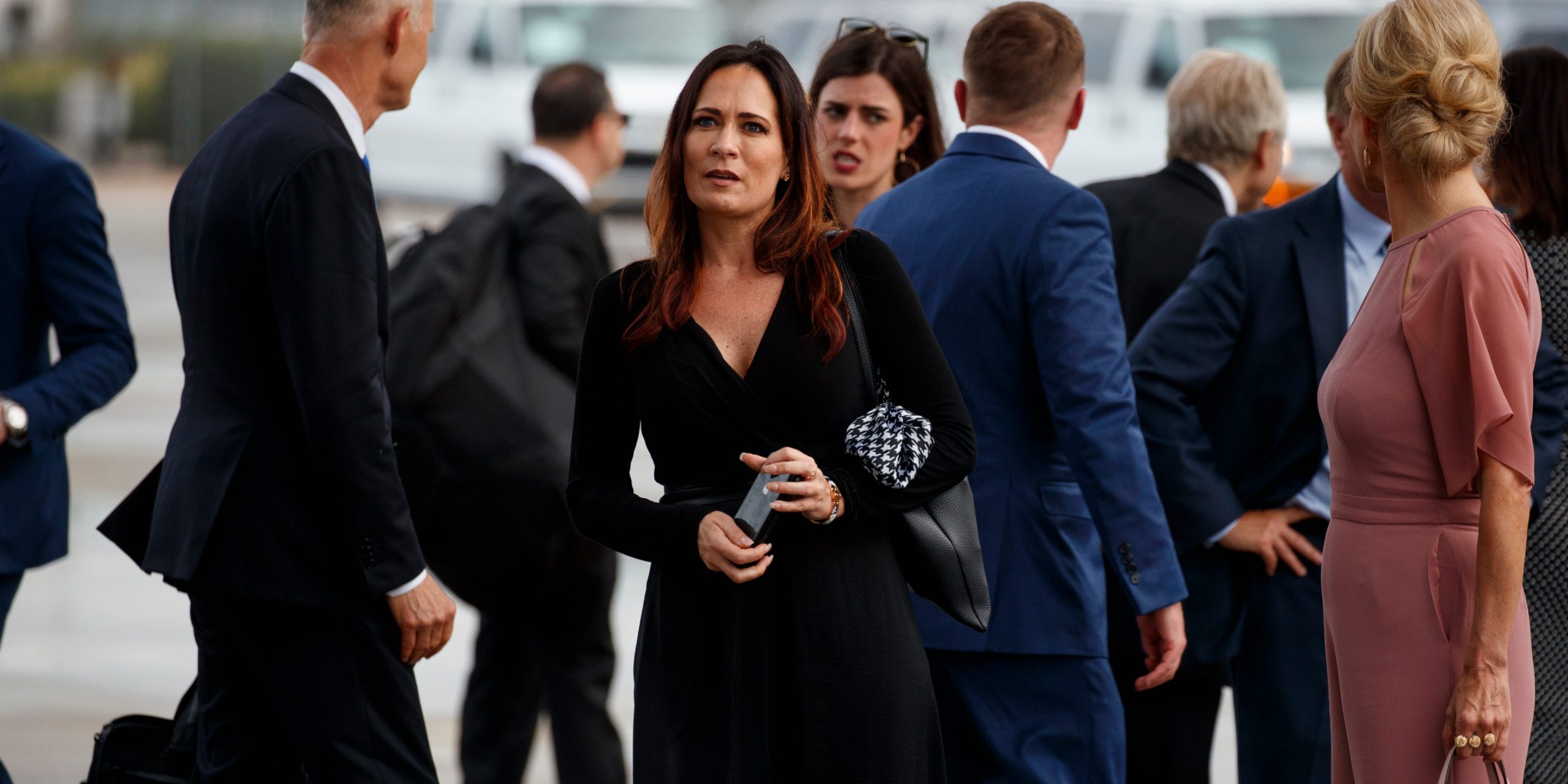 Stephanie Grisham, spokeswoman for first lady Melania Trump, stands at Orlando International Airport ahead of President Donald Trump's re-election kickoff rally at the Amway Center, Tuesday, June 18, 2019, in Orlando, Fla. (AP Photo/Evan Vucci)