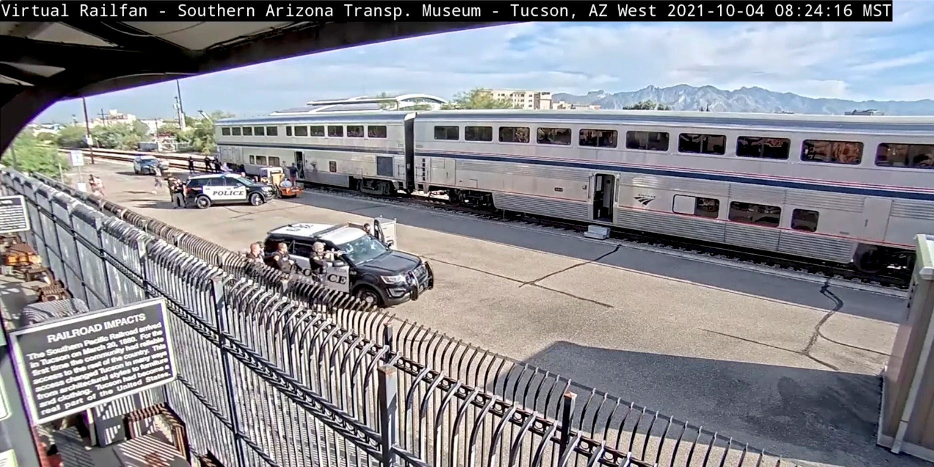 People are evacuated from an Amtrak train at a train station in Tucson, Arizona, U.S. October 4, 2021 in this still image obtained from a surveillance camera video on October 5, 2021.
