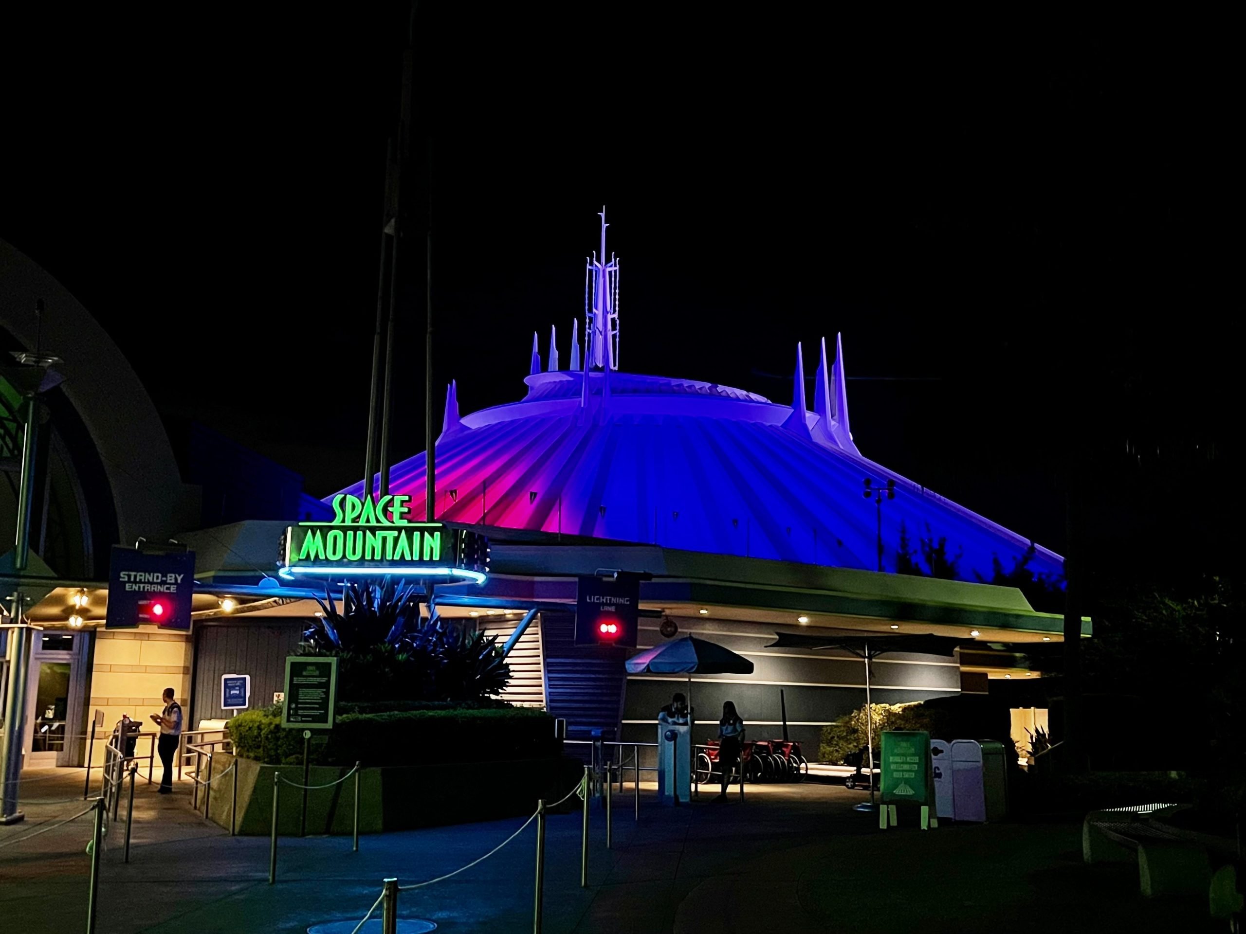 space mountain entrance lit up at night magic kingdom