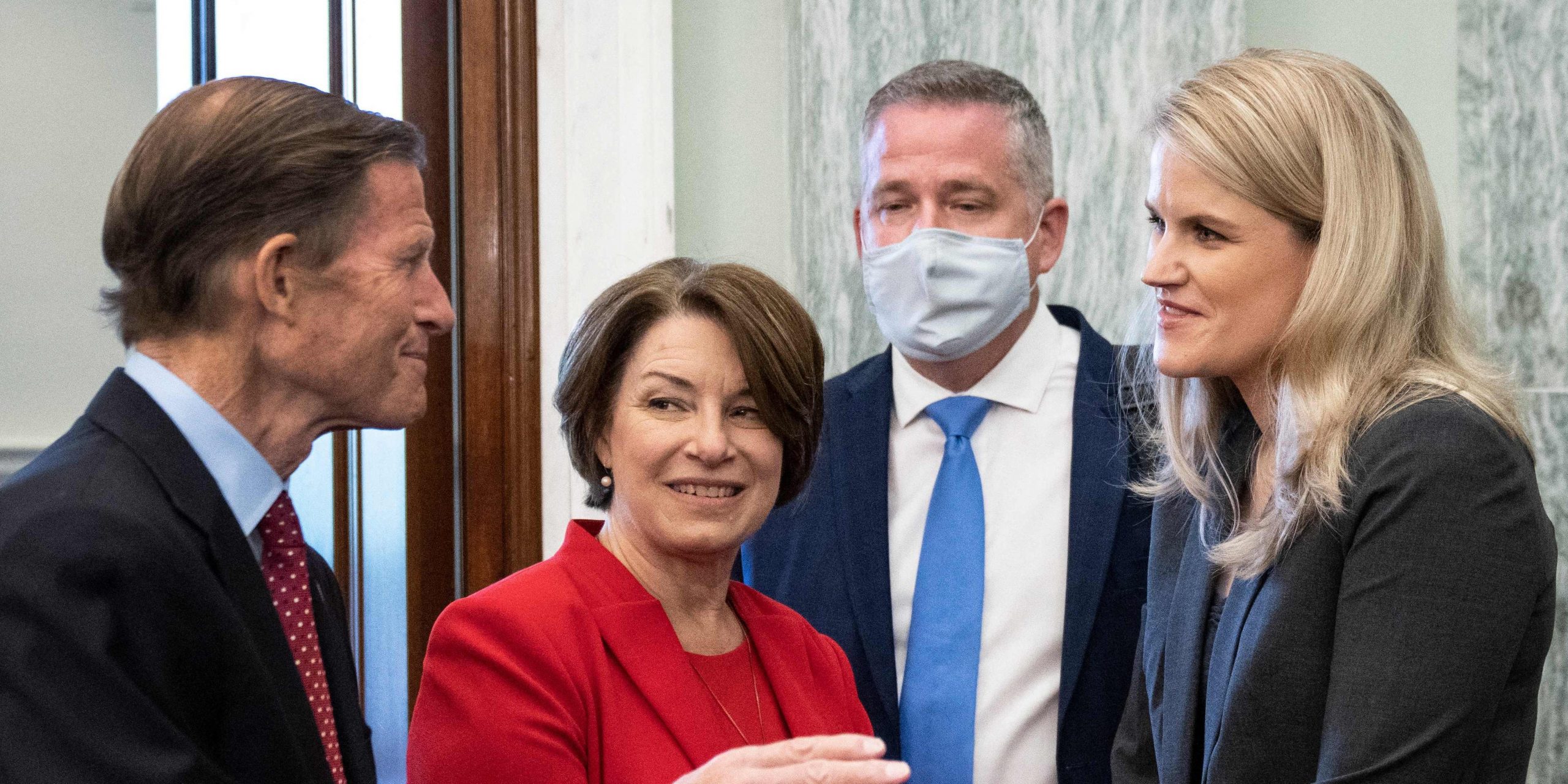 Facebook whistleblower Frances Haugen is welcomed by US Sens. Richard Blumenthal of Connecticut and Amy Klobuchar of Minnesota before a Senate Committee on Commerce, Science, and Transportation hearing on Capitol Hill on October 5, 2021.