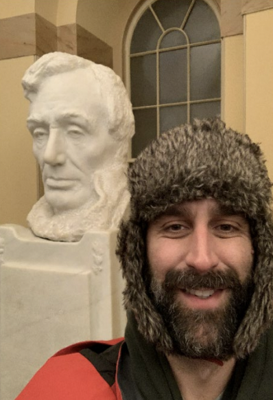 Matthew Mazzocco takes a selfie in front of the Abraham Lincoln bust inside the Capitol.