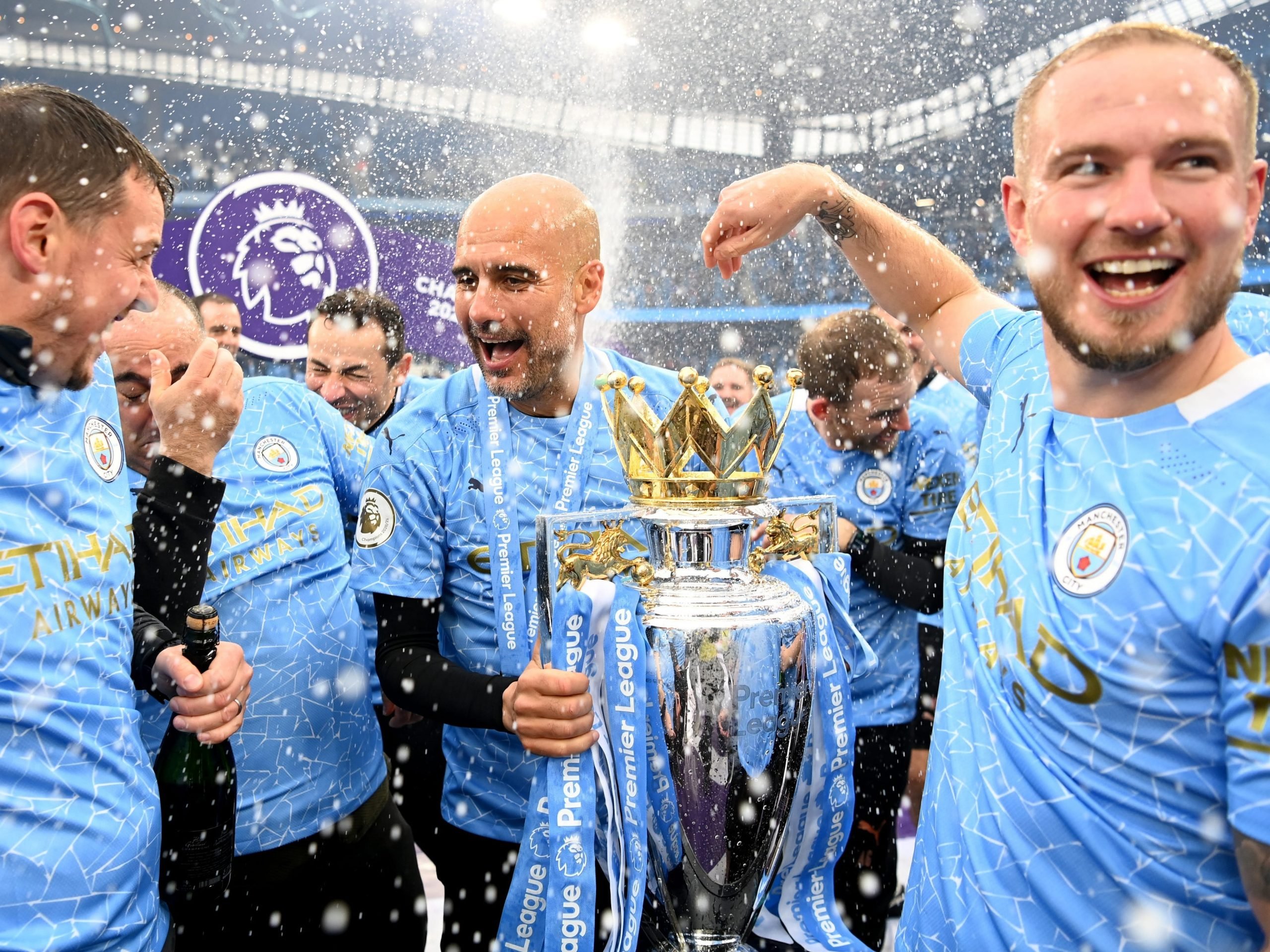 Pep Guardiola celebrates winning the Premier League