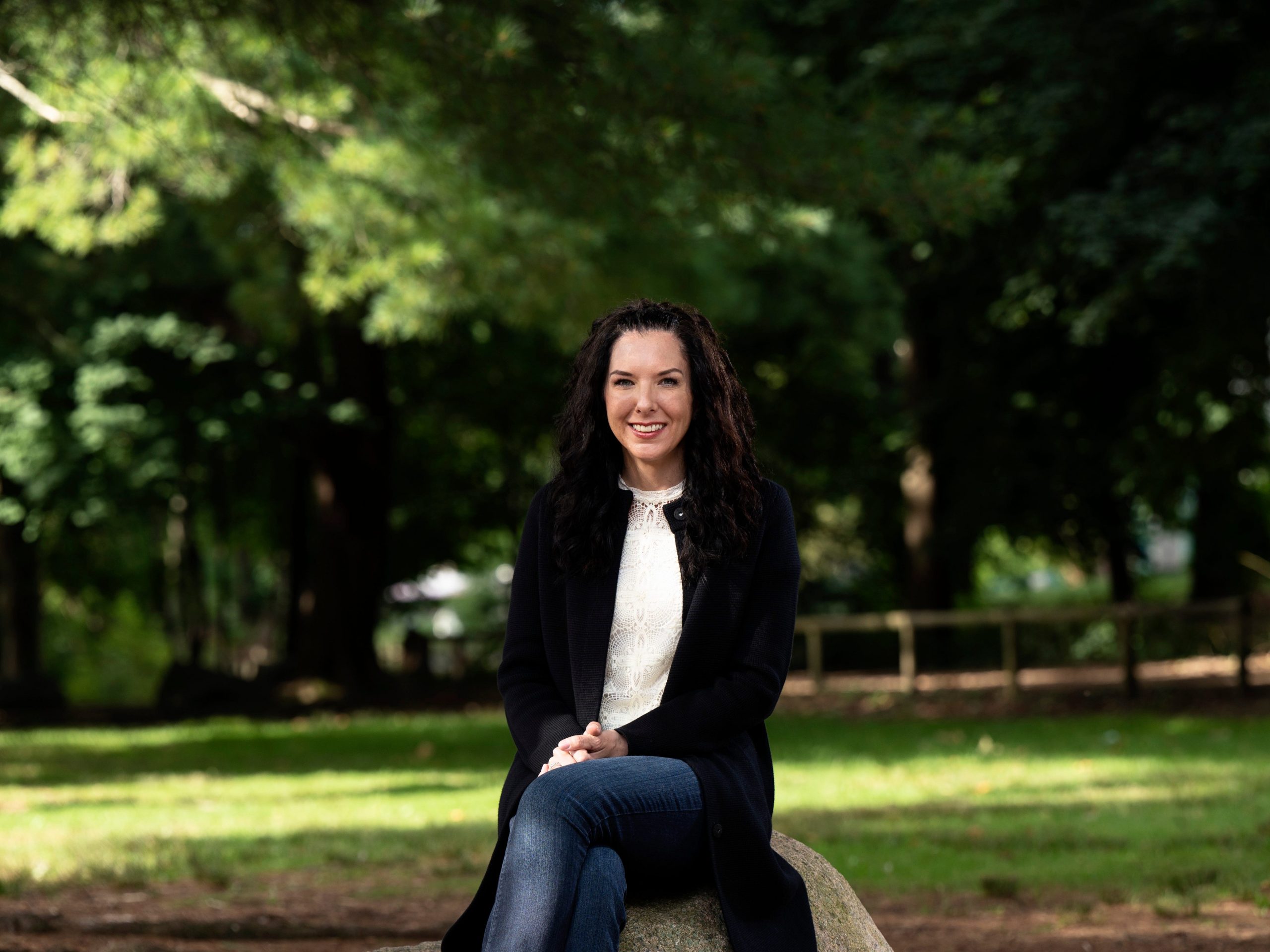 Michelle L'Heureux sitting at a park