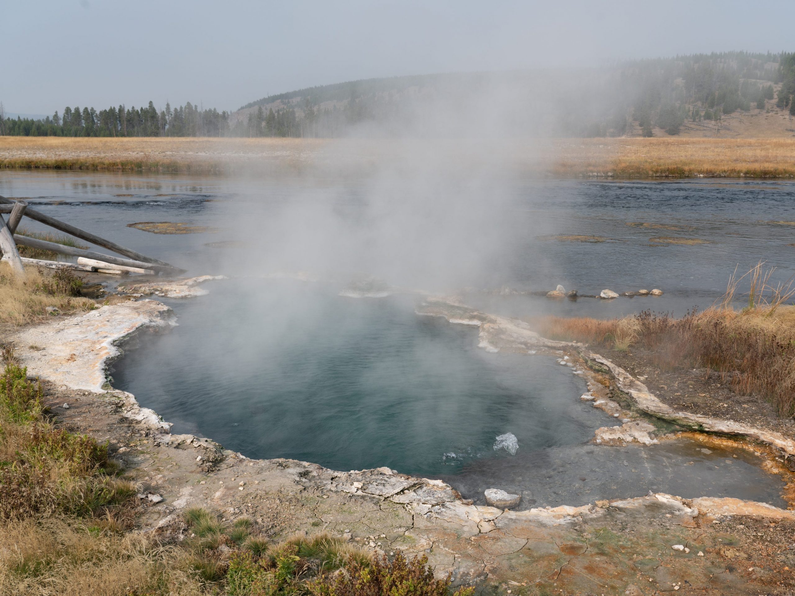 The Maiden's Grave Spring by the Firehole River on the Fountain Flats Drive in Yellowstone National Park in Wyoming, USA.